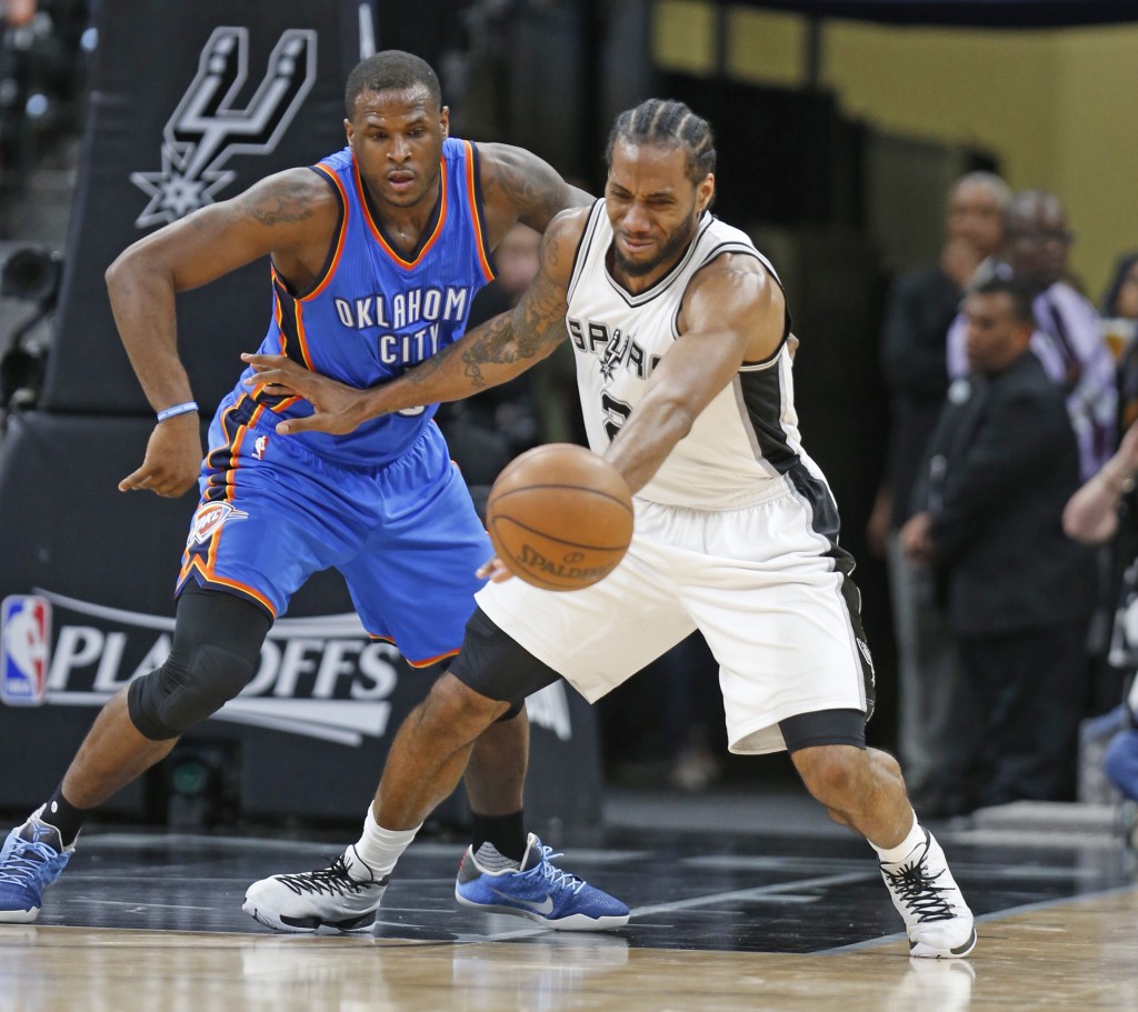 SAN ANTONIO,TX - MAY 2: Kawhi Leonard #2 of the San Antonio Spurs prevents Dion Waiters #3 of the Oklahoma City Thunder from making a steal during game Two of the Western Conference Semifinals for the 2016 NBA Playoffs at AT&T Center on May 2, 2016 in San Antonio, Texas. NOTE TO USER: User expressly acknowledges and agrees that , by downloading and or using this photograph, User is consenting to the terms and conditions of the Getty Images License Agreement.   Ronald Cortes/Getty Images/AFP
