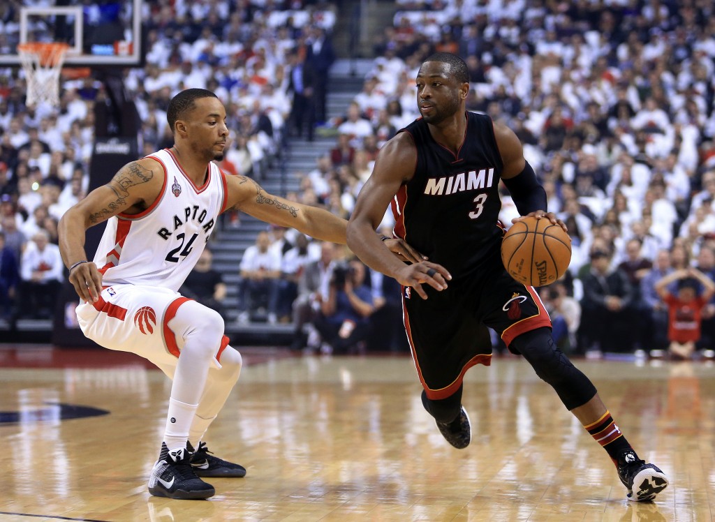 TORONTO, ON - MAY 03: Dwyane Wade #3 of the Miami Heat dribbles the ball as Norman Powell #24 of the Toronto Raptors defends in the first half of Game One of the Eastern Conference Semifinals during the 2016 NBA Playoffs at the Air Canada Centre on May 3, 2016 in Toronto, Ontario, Canada. NOTE TO USER: User expressly acknowledges and agrees that, by downloading and or using this photograph, User is consenting to the terms and conditions of the Getty Images License Agreement.   Vaughn Ridley/Getty Images/AFP