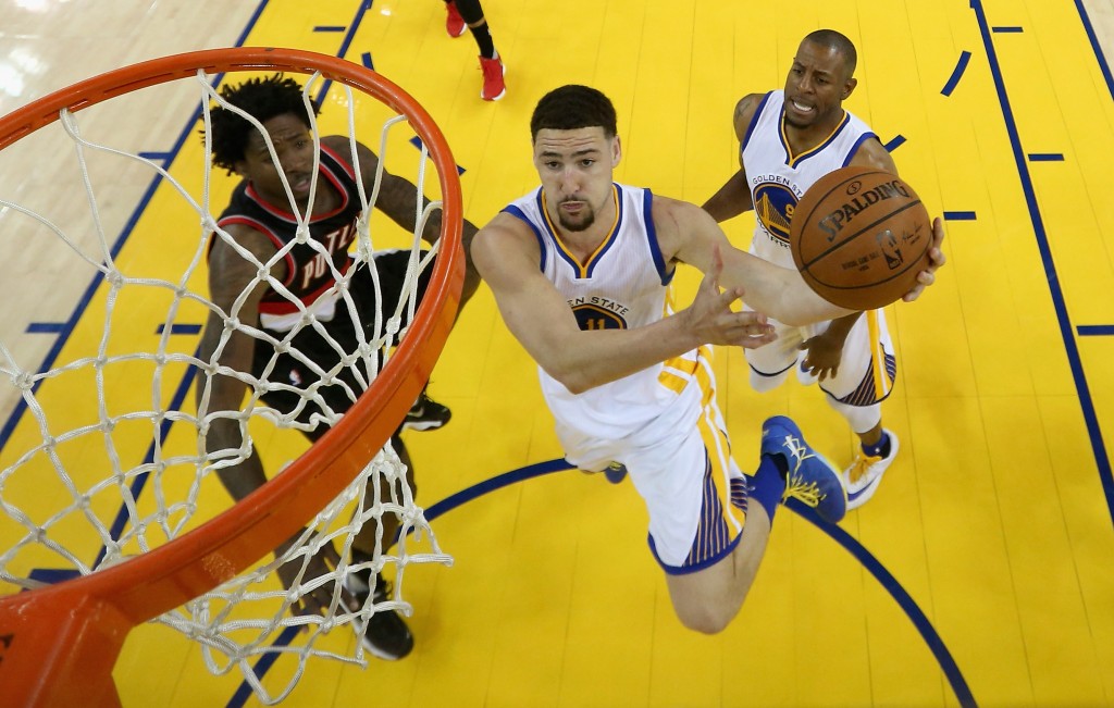 OAKLAND, CA - MAY 03: Klay Thompson #11 of the Golden State Warriors goes up for a shot against Ed Davis #17 of the Portland Trail Blazers during Game Two of the Western Conference Semifinals during the 2016 NBA Playoffs on May 3, 2016 at Oracle Arena in Oakland, California. NOTE TO USER: User expressly acknowledges and agrees that, by downloading and or using this photograph, User is consenting to the terms and conditions of the Getty Images License Agreement.   Ezra Shaw/Getty Images/AFP