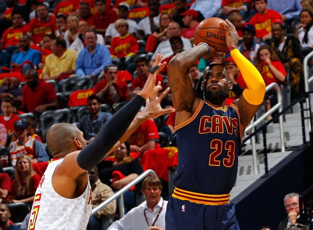 ATLANTA, GA - MAY 06: LeBron James #23 of the Cleveland Cavaliers shoots against Al Horford #15 of the Atlanta Hawks in Game Three of the Eastern Conference Semifinals during the 2016 NBA Playoffs at Philips Arena on May 6, 2016 in Atlanta, Georgia. NOTE TO USER User expressly acknowledges and agrees that, by downloading and or using this photograph, user is consenting to the terms and conditions of the Getty Images License Agreement.   Kevin C. Cox/Getty Images/AFP