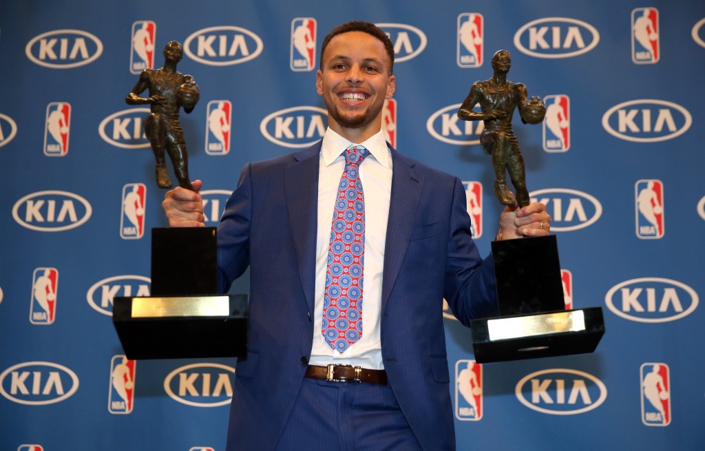 OAKLAND, CA - MAY 10: Stephen Curry of the Golden State Warriors poses with his back-to-back NBA Most Valuable Player Awards following a press conference at ORACLE Arena on May 10, 2016 in Oakland, California. NOTE TO USER: User expressly acknowledges and agrees that, by downloading and or using this photograph, User is consenting to the terms and conditions of the Getty Images License Agreement.   Ezra Shaw/Getty Images/AFP