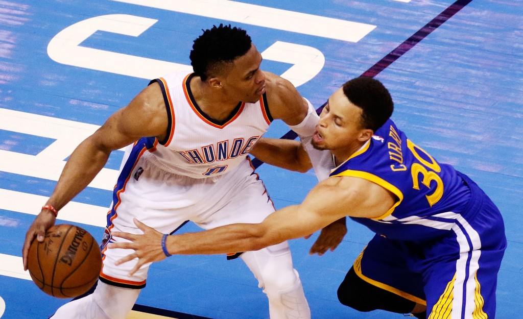 OKLAHOMA CITY, OK - MAY 24: Russell Westbrook #0 of the Oklahoma City Thunder drives against Stephen Curry #30 of the Golden State Warriors in the second half in game four of the Western Conference Finals during the 2016 NBA Playoffs at Chesapeake Energy Arena on May 24, 2016 in Oklahoma City, Oklahoma. NOTE TO USER: User expressly acknowledges and agrees that, by downloading and or using this photograph, User is consenting to the terms and conditions of the Getty Images License Agreement.   J Pat Carter/Getty Images/AFP