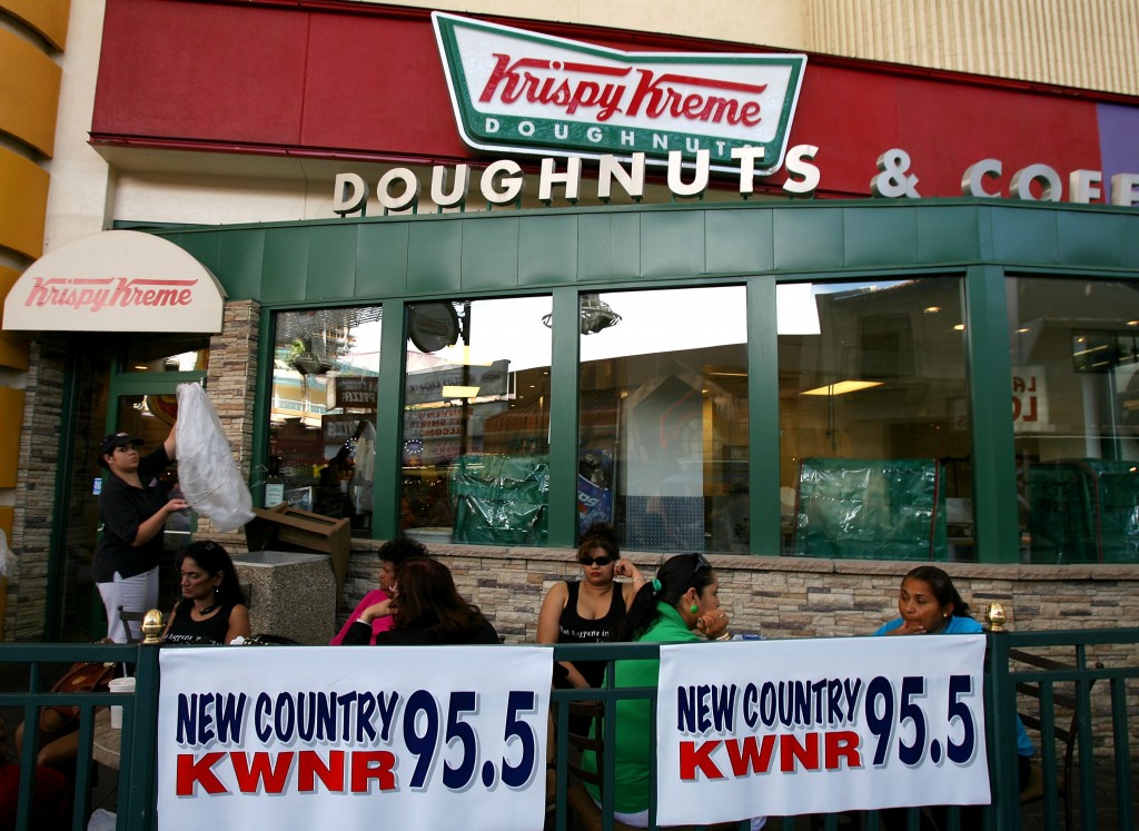 LAS VEGAS - MAY 13:  Fans listen to the Montgomery Gentry perform as they relax at Krispy Kreme during day two of the Academy of Country Music All Star Concert at the Fremont Street Experience on May 13, 2007 in Las Vegas, Nevada.  (Photo by Michael Buckner/Getty Images)