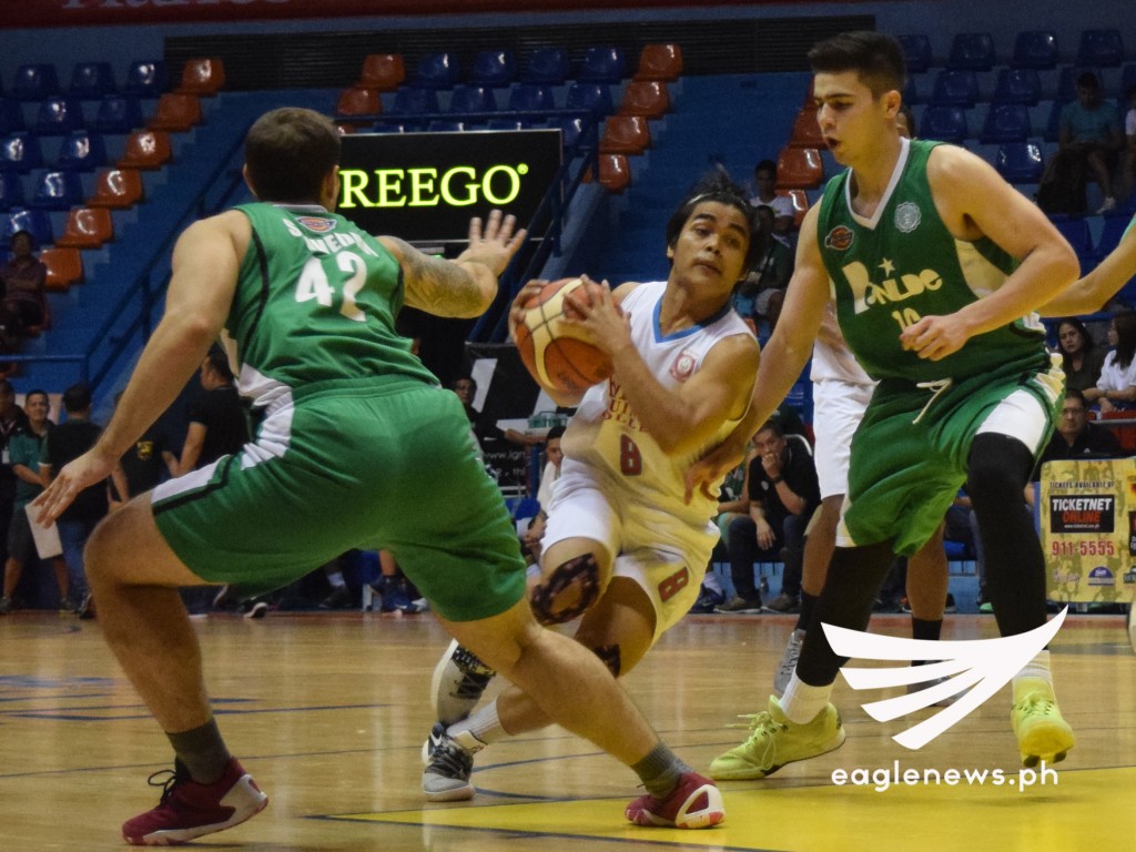 Emilio Aguinaldo College guard Raymund Pascua drives against Benilde forwards Fons Saavedra and Edward Dixon in their Filoil Flying V Hanes Premier Cup game on Thursday. (Photo courtesy: Ariane Joy Sabale / Sports On Air, Eagle News Service)
