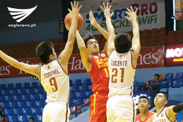 San Sebastian guard Jerick Fabian puts up a shot against Perpetual Help guards Jeffrey Coronel and Kervin Lucente during their Filoil Flying V Hanes Pre-Season Premier Cup game on Friday. (Photo courtesy: Prince Coz / Sports On Air, Eagle News Service)