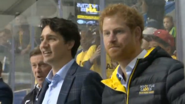 Prince Harry and Canadian Prime Minister drop the puck to kick off the countdown to the Toronto Invictus Games.(photo grabbed fron Reuters video)