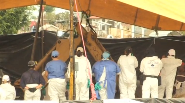 Forensic investigators converge on a dusty town in Mexico's Morelos state to exhume more than 100 bodies reportedly discovered in a mass grave(photo grabbed from Reuters video) 