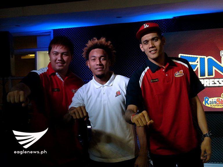 Rain or Shine forward Beau Belga (left) and Raymond Almazan (right) poses for photos with Alaska Aces forward Calvin Abueva during the PBA Commissioner's Cup press conference at the PBA Cafe Metrowalk. (Photo courtesy: Diego de la Paz / Sports On Air, Eagle News Service)