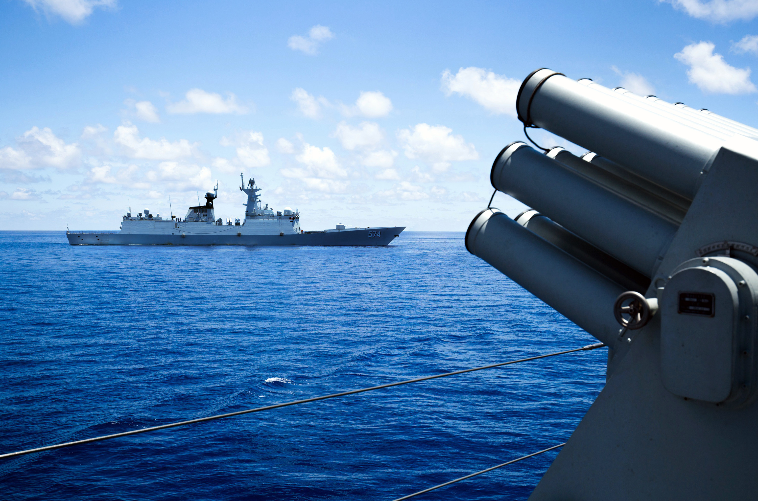 This photo taken on May 10, 2016 shows crew members of China's South Sea Fleet taking part in a logistics supply drill near the James Shoal area on South China Sea. Beijing claims sovereignty over almost the whole of the South China Sea, on the basis of a segmented line that first appeared on Chinese maps in the 1940s, pitting it against several neighbours. / AFP PHOTO / STR / China OUT / TO GO WITH AFP STORY CHINA-POLITICS-MARITIME-DIPLOMACY BY BEN DOOLEY