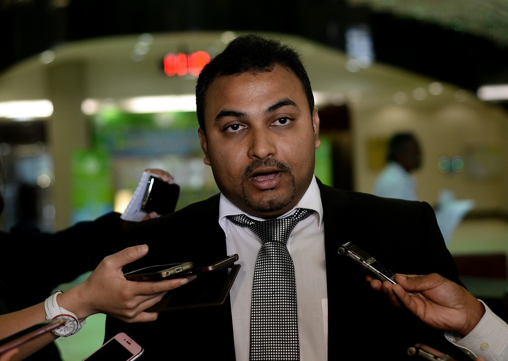 Malaysian lawyer Balan Nair, representing families of the ill-fated Malaysia Airlines flight MH17 crew members, speaks with journalists prior to filing the lawsuit at the Kuala Lumpur Courts Complex on June 2, 2016. Families of six Malaysia Airlines crew members who perished when flight MH17 was shot down over Ukraine nearly two years ago filed a lawsuit blaming the carrier for the tragedy. / AFP PHOTO / MANAN VATSYAYANA