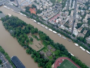 This aerial photo taken and handout on June 4, 2016, by the French air force shows the Lebaudy Parc in Puteaux, west of Paris, flooded by the River Seine after it burst its banks near the pont de Neuilly bridge. The rain-swollen River Seine in Paris began to recede on June 4, 2016, after reaching its highest level in three decades, easing fears after floods sent the Louvre and other riverside museums scrambling to protect their treasures. From a peak of 6.10 metres (20 feet) in the early hours of Saturday, the river began to subside, falling to 5.99 metres at 5pm (1500 GMT), the environment ministry's Vigicrues flood watch website said. / AFP PHOTO / HO / RESTRICTED TO EDITORIAL USE - MANDATORY CREDIT "AFP PHOTO / FRENCH AIR FORCE / ARMEE DE L'AIR" 