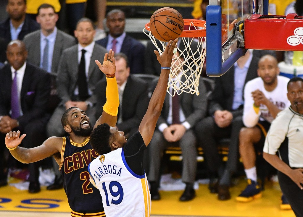 Golden State Warriors guard Leandro Barbosa (R) scores during the fourth quarter in Game 2 of the NBA Finals on June 05, 2016 in Oakland, California. Draymond Green scored 28 points and Stephen Curry added 18 as defending champion Golden State overwhelmed Cleveland 110-77 in the NBA Finals, pushing the Warriors halfway to a title repeat. / AFP PHOTO / JOSH EDELSON