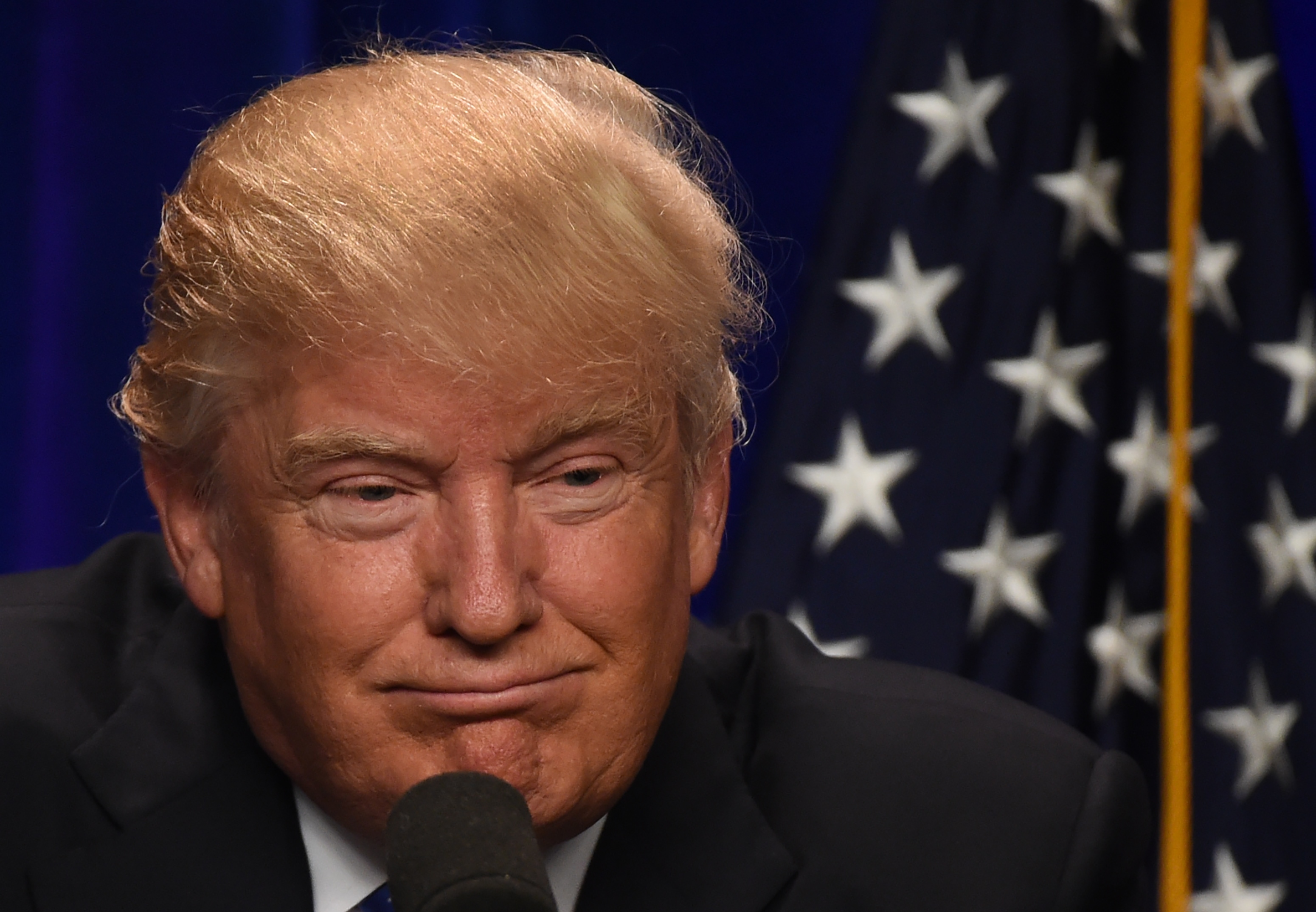 Republican presidential candidate Donald J. Trump speaks at the Saint Andelm College New Hampshire Institute of Politics in Manchester, New Hampshire June 13, 2016. / AFP PHOTO / TIMOTHY A. CLARY