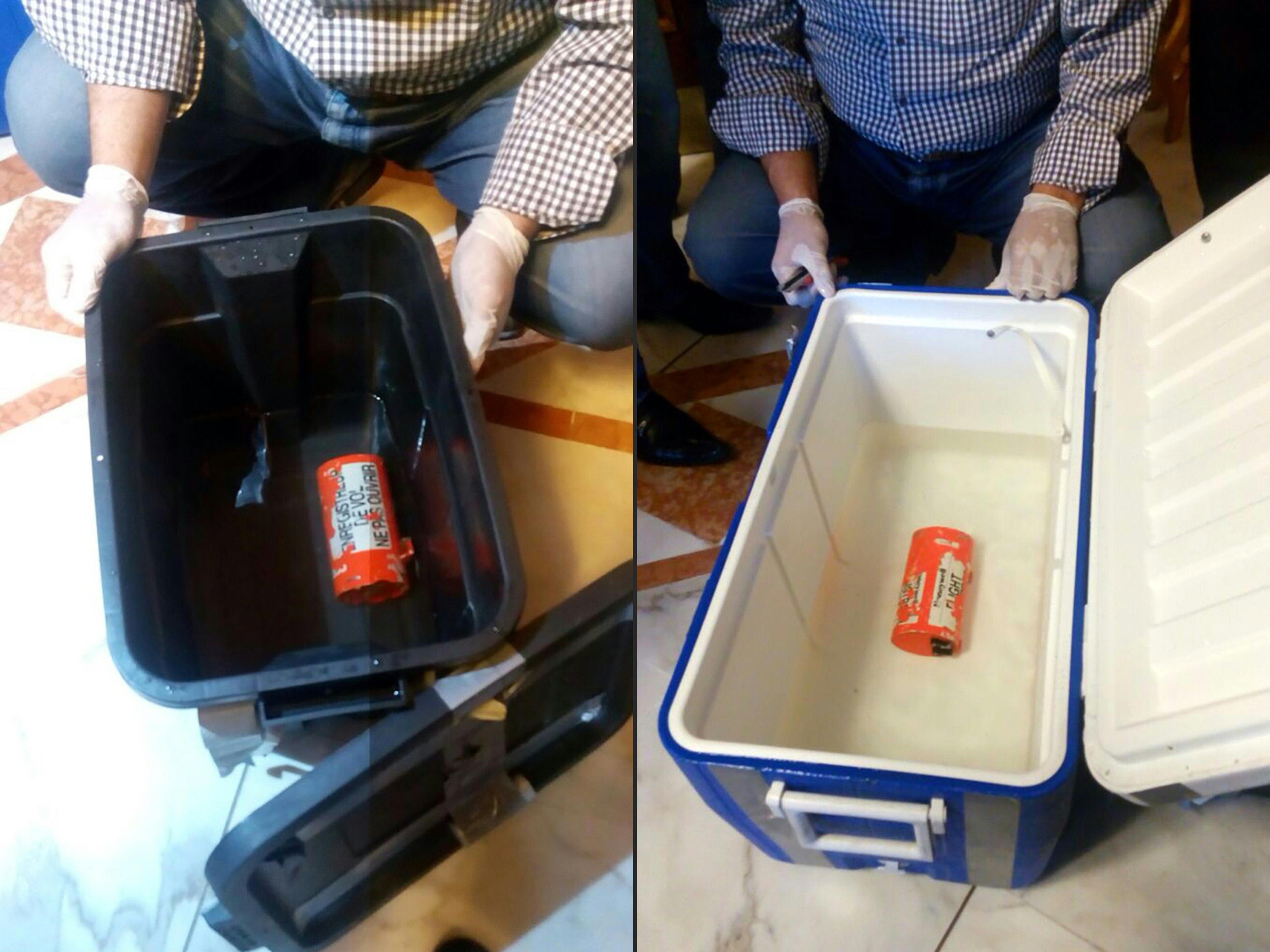 (COMBO) This combination of pictures created on June 17, 2016 shows a handout picture taken at an undisclosed location in Egypt and released by the Egyptian Media Center of the ministry of Civil Aviation on June 17, 2016 showing the flight recorder (L) from the EgyptAir plane, that crashed into the Mediterranean last month, after it was recovered from the bottom of the Mediterranean by search teams. AND a handout picture taken at an undisclosed location in Egypt and released by the Egyptian Media Center of the ministry of Civil Aviation on June 17, 2016 showing one of the two black boxes from the EgyptAir plane, that crashed into the Mediterranean last month, after it was recovered from the bottom of the Mediterranean by search teams. Egyptian investigators said search teams managed to recover the Airbus A320's flight data recorder -- which gathers information about the speed, altitude and direction of the plane -- a day after they retrieved its cockpit voice recorder. EgyptAir Flight MS804 from Paris to Cairo disappeared from radar screens in the eastern Mediterranean last month with 66 people on board, and a vast search operation has since scoured swathes of sea off Egypt's northern coast. / AFP PHOTO / MEDIA CENTER OF THE EGYPTIAN MINISTRY OF CIVIL AVIATION / HO / ===RESTRICTED TO EDITORIAL USE - MANDATORY CREDIT "AFP PHOTO / MEDIA CENTER OF THE EGYPTIAN MINISTRY OF CIVIL AVIATION - NO MARKETING NO ADVERTISING CAMPAIGNS - DISTRIBUTED AS A SERVICE TO CLIENTS FROM FROM ALTERNATIVE SOURCES, THEREFORE AFP IS NOT RESPONSIBLE FOR ANY DIGITAL ALTERATIONS TO THE PICTURE'S EDITORIAL CONTENT, DATE AND LOCATION WHICH CANNOT BE INDEPENDENTLY VERIFIED == ===RESTRICTED TO EDITORIAL USE - MANDATORY CREDIT "AFP PHOTO / MEDIA CENTER OF THE EGYPTIAN MINISTRY OF CIVIL AVIATION - NO MARKETING NO ADVERTISING CAMPAIGNS - DISTRIBUTED AS A SERVICE TO CLIENTS FROM FROM ALTERNATIVE SOURCES, THEREFORE AFP IS NOT RESPONSIBLE FOR ANY DIGITAL ALTERATIONS TO THE PICTURE'S EDITORIAL CONTE