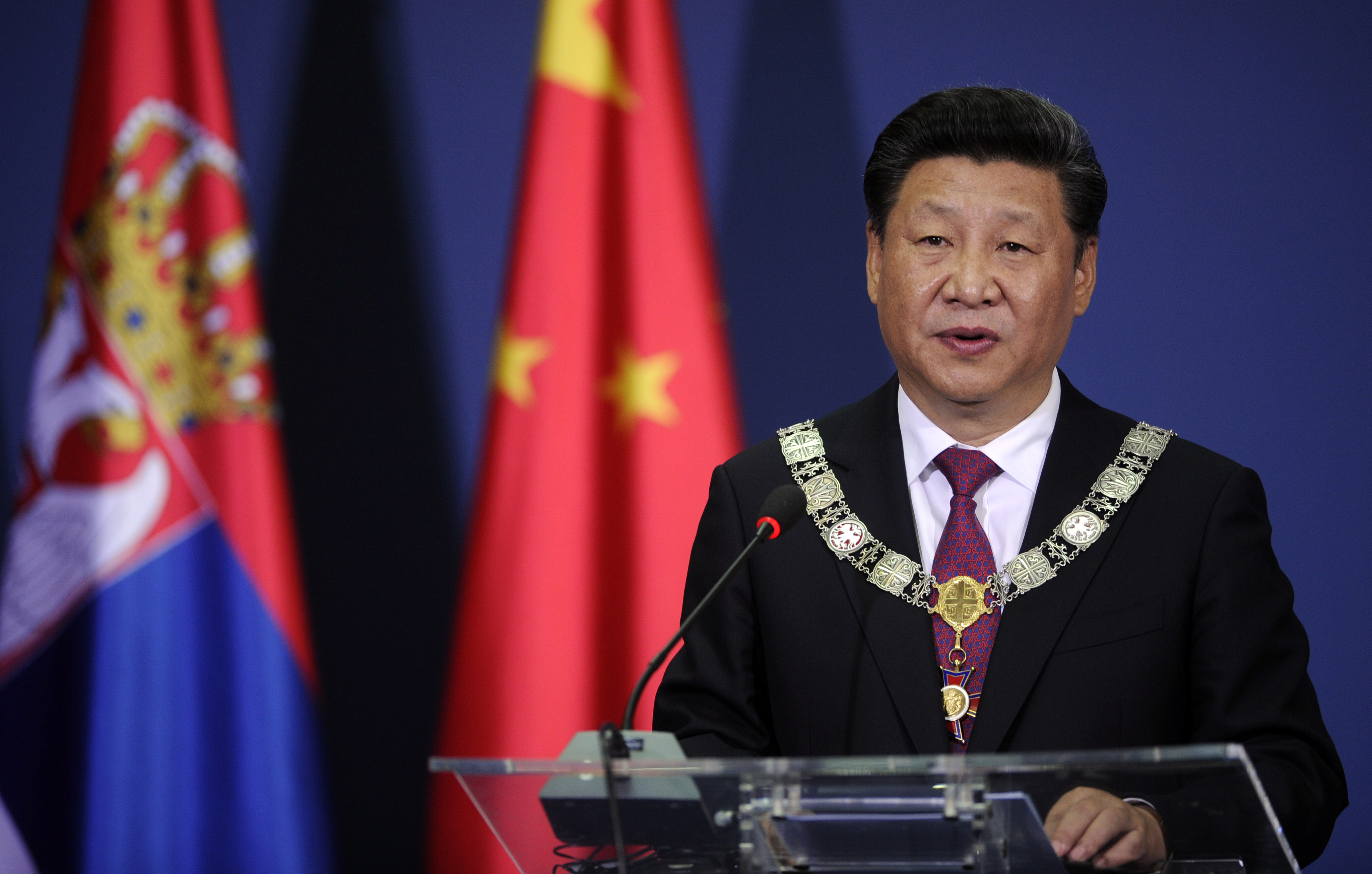 China's President Xi Jinping speaks during a joint press conference with his Serbian counterpart in Belgrade on June 18, 2016. / AFP PHOTO / OLIVER BUNIC