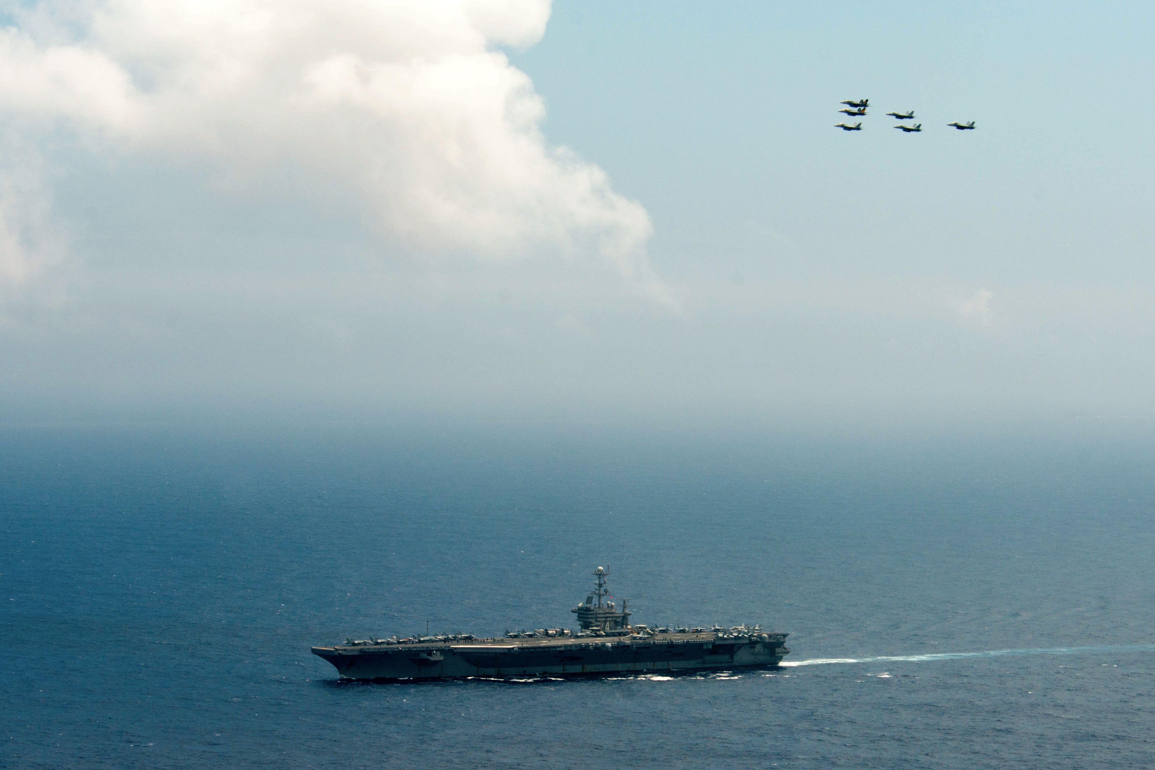 This photo taken on June 18, 2016 and released June 19, 2016 by the US Navy shows a flight formation from Carrier Air Wing (CVW) 5 and 9 above the Nimitz-class aircraft carrier USS John C. Stennis (CVN-74) in the Philippine Sea. Two US aircraft carriers have started exercises in the Philippine Sea, defence officials said June 19, as Washington's close ally Manila faces growing pressure from Beijing in the South China Sea. / AFP PHOTO / US NAVY / TOMAS COMPIAN / RESTRICTED TO EDITORIAL USE - MANDATORY CREDIT "AFP PHOTO / US NAVY / TOMAS COMPIAN" - NO MARKETING NO ADVERTISING CAMPAIGNS - DISTRIBUTED AS A SERVICE TO CLIENTS