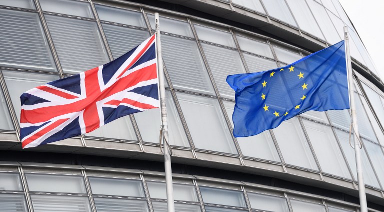  This file photo taken on May 27 shows the British Union flag (L) and the European Union (EU) flag flying side-by-side outside City Hall, the headquarters of the Greater London Authority, in central London. AFP Photo/ Leon Neal