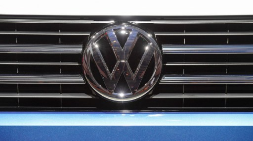 A Volkswagen logo is seen on a VW Multivan on display during German carmaker Volkswagen shareholders' annual general meeting on June 22, 2016 in Hanover. The boss of embattled German auto giant Volkswagen issued an apology to angry shareholders over the emissions cheating scandal that has plunged the group into an unprecedented crisis. / AFP PHOTO / John MACDOUGALL