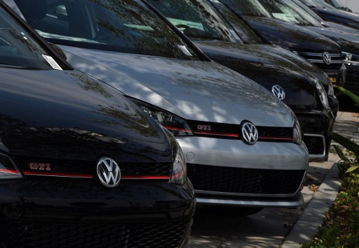 Volkswagen cars at a dealership in Los Angeles, California on June 28, 2016. Volkswagen has agreed to pay out $14.7 billion in a settlement with US authorities and car owners over its emissions-cheating diesel-powered cars. The settlement filed in federal court calls for the German auto giant to either buy back or fix the cars that tricked pollution tests, and to pay each owner up to $10,000 in cash. / AFP PHOTO / Mark Ralston