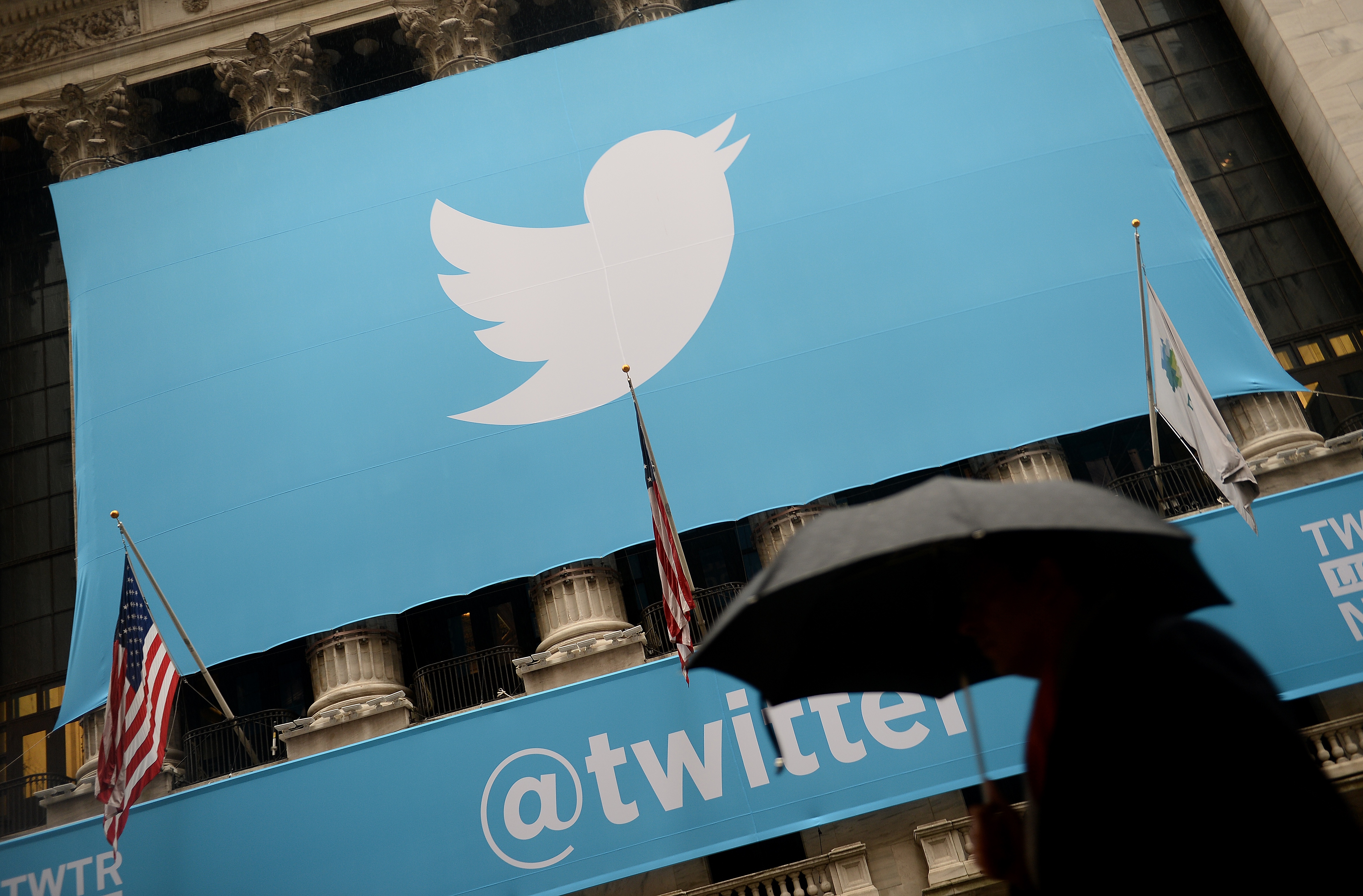A banner with the logo of Twitter is set on the front of the New York Stock Exchange (NYSE) on November 7, 2013 in New York.  Twitter hit Wall Street with a bang on Thursday, as an investor frenzy quickly sent shares surging after the public share offering for the fast-growing social network. In the first exchanges, Twitter vaulted 80.7 percent to $47, a day after the initial public offering (IPO) at $26 per share. While some analysts cautioned about the fast-changing nature of social media, the debut led to a stampede for Twitter shares. AFP PHOTO/EMMANUEL DUNAND / AFP PHOTO / EMMANUEL DUNAND