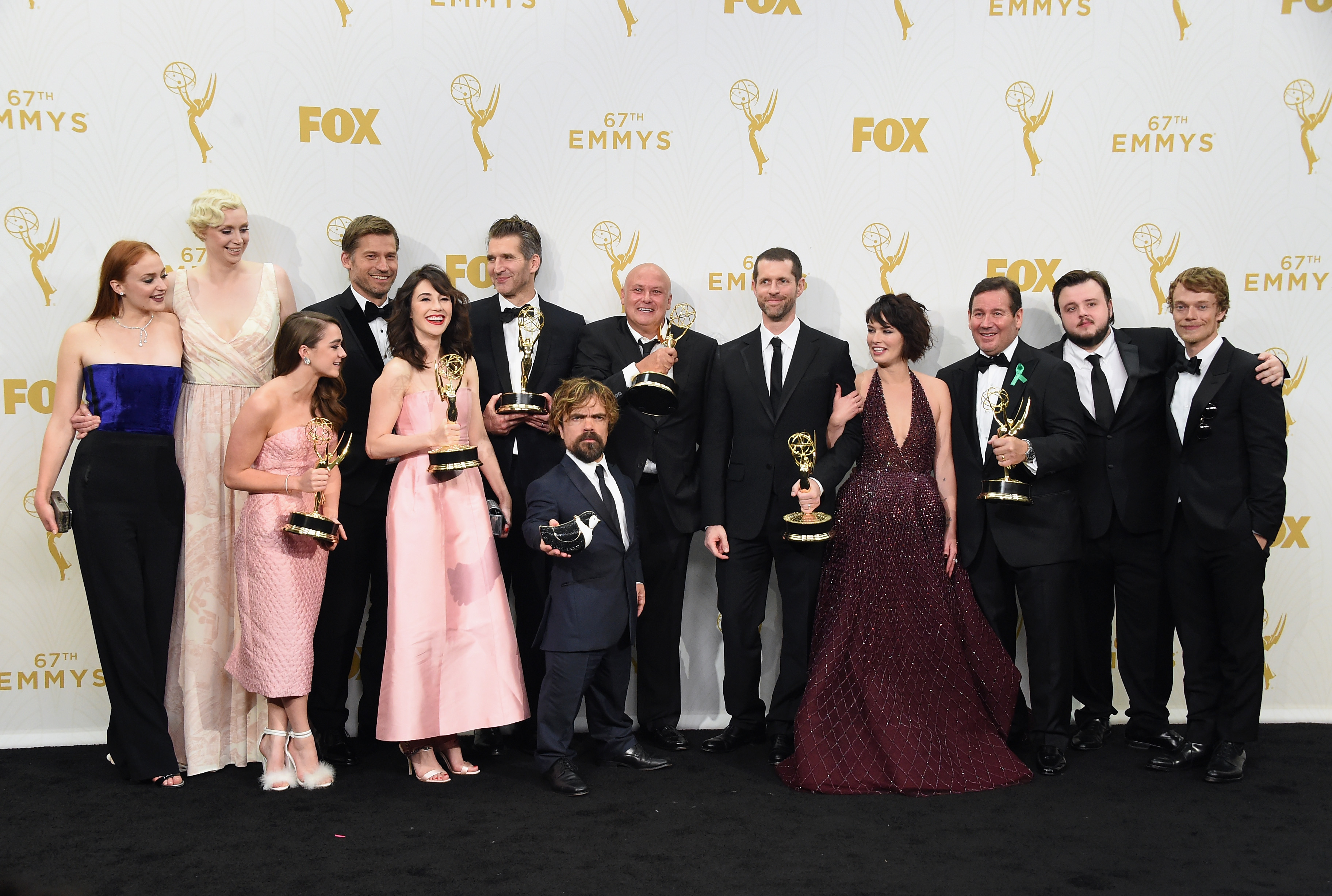 LOS ANGELES, CA - SEPTEMBER 20: (L-R) Actors Sophie Turner, Gwendoline Christie, Maisie Williams, Nikolaj Coster-Waldau, Carice van Houten, writer David Benioff, actor Peter Dinklage, Conleth Hill, writer D. B. Weiss, Lena Headey, director David Nutter and actors John Bradley-West and Alfie Allen, winners of Outstanding Drama Series for "Game of Thrones", pose in the press room at the 67th Annual Primetime Emmy Awards at Microsoft Theater on September 20, 2015 in Los Angeles, California.   Jason Merritt/Getty Images/AFP