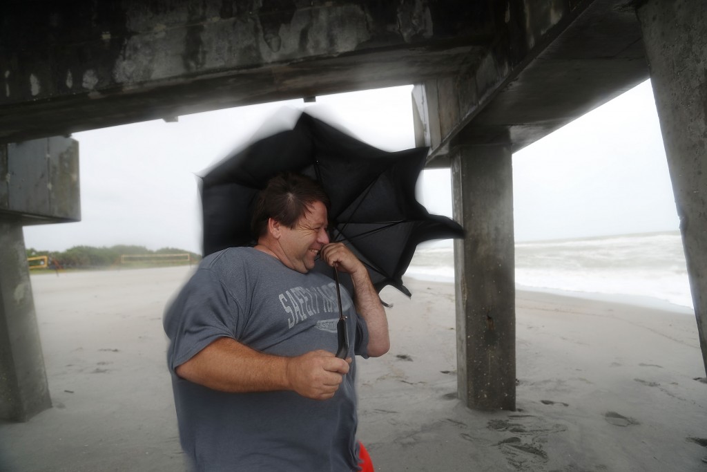 VENICE, FL - JUNE 06: Dan Finton uses his umbrella as he walks along the beach as high winds and waves from Tropical Storm Colin come ashore on June 6, 2016 in Venice, Florida. The Florida Gov. Rick Scott declared a state of emergency with Tropical Storm Colin as it brings high winds and a serious threat of flooding. Joe Raedle/Getty Images/AFP