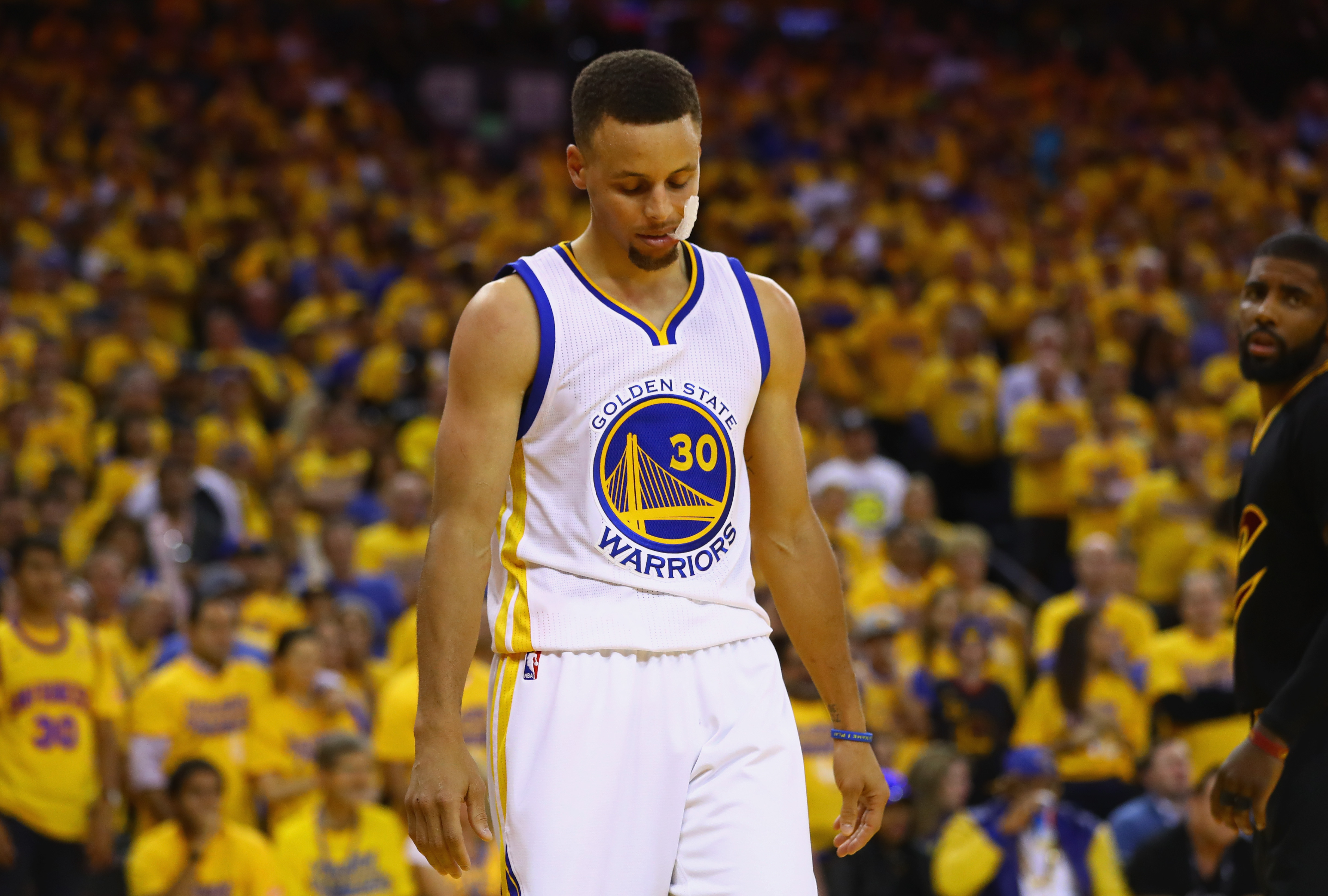 OAKLAND, CA - JUNE 13: Stephen Curry #30 of the Golden State Warriors reacts during the second half against the Cleveland Cavaliers in Game 5 of the 2016 NBA Finals at ORACLE Arena on June 13, 2016 in Oakland, California. NOTE TO USER: User expressly acknowledges and agrees that, by downloading and or using this photograph, User is consenting to the terms and conditions of the Getty Images License Agreement.   Ezra Shaw/Getty Images/AFP