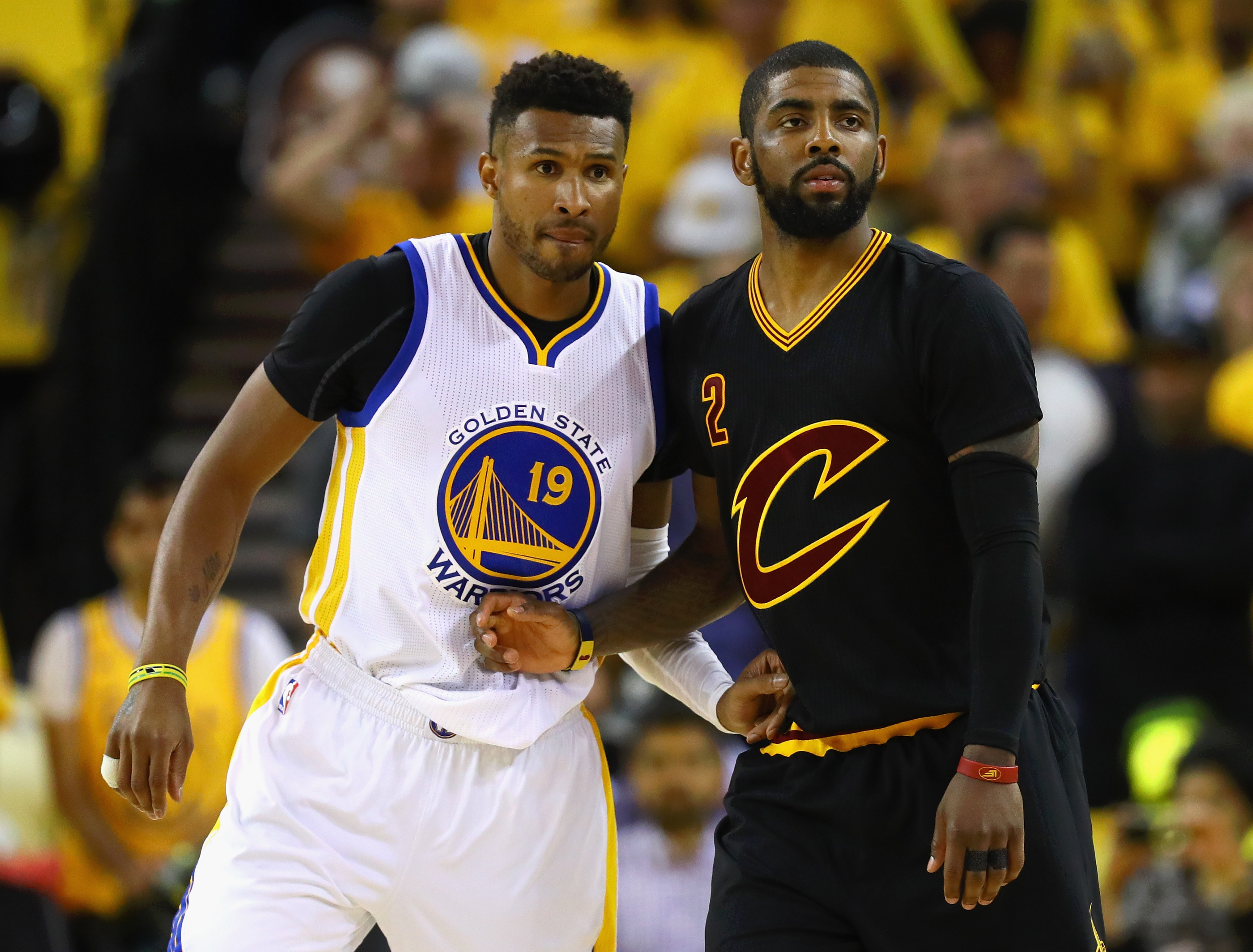 OAKLAND, CA - JUNE 13: Leandro Barbosa #19 of the Golden State Warriors and Kyrie Irving #2 of the Cleveland Cavaliers look on during the second half in Game 5 of the 2016 NBA Finals at ORACLE Arena on June 13, 2016 in Oakland, California. NOTE TO USER: User expressly acknowledges and agrees that, by downloading and or using this photograph, User is consenting to the terms and conditions of the Getty Images License Agreement.   Ezra Shaw/Getty Images/AFP