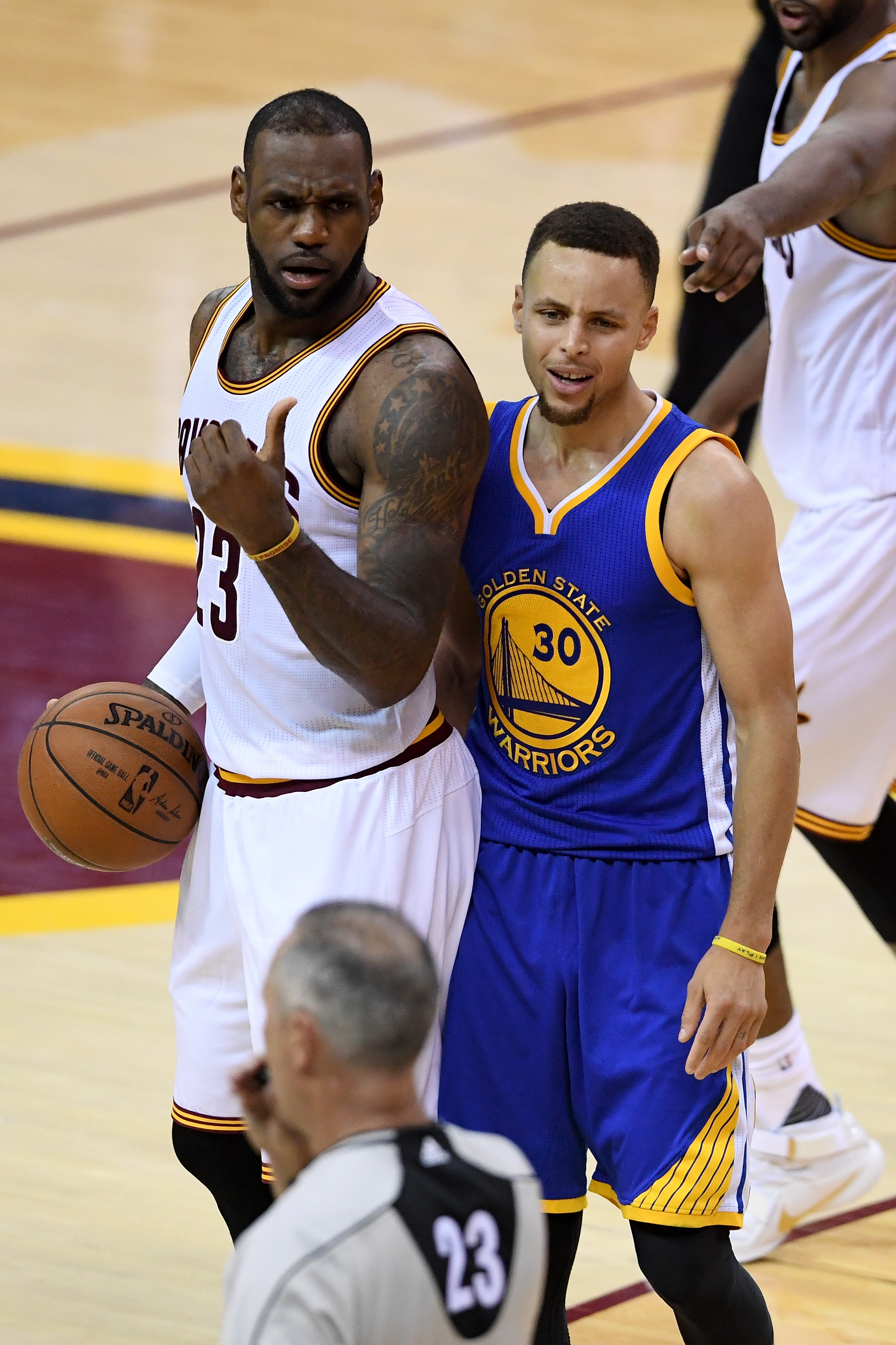 CLEVELAND, OH - JUNE 16: Stephen Curry #30 of the Golden State Warriors reacts to a foul call during the fourth quarter as LeBron James #23 of the Cleveland Cavaliers looks on in Game 6 of the 2016 NBA Finals at Quicken Loans Arena on June 16, 2016 in Cleveland, Ohio. NOTE TO USER: User expressly acknowledges and agrees that, by downloading and or using this photograph, User is consenting to the terms and conditions of the Getty Images License Agreement.   Jason Miller/Getty Images/AFP