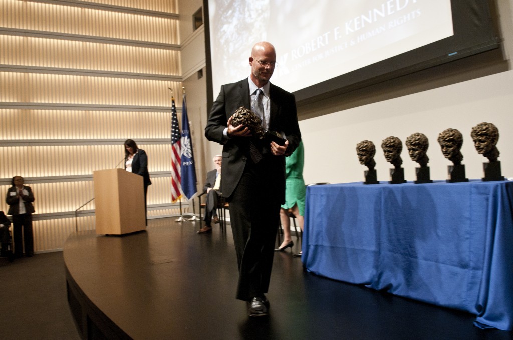 WASHINGTON, DC - MAY 18: David Gilkey accepts the International Photography Award during the 2011 Robert F. Kennedy Center For Justice & Human Rights Book And Journalism Awards at the United States Institute of Peace on May 18, 2011 in Washington, DC. Kris Connor/Getty Images/AFP