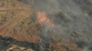 Firefighters battle a raging wildfire near Yarnell, Arizona (photo grabbed from Reuters video)