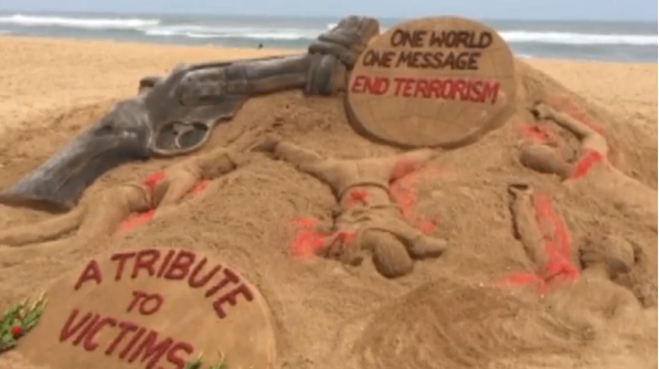 A sand artist in India pays tribute to victims of Florida mass killing with a sculpture on the shore of Puri beach in eastern Odisha state.(photo grabbed from Reuters video) 