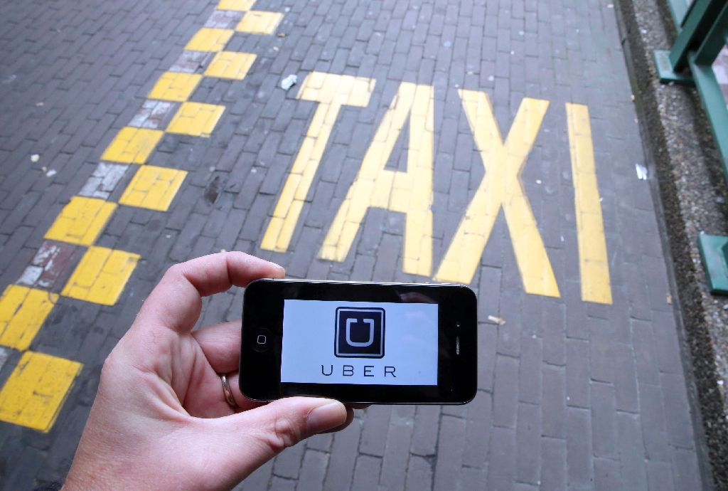 Uber has been accused of producing advertisements portraying UberPOP is a normal taxi service rather than a ride-sharing service (AFP Photo/Nicolas Maeterlinck)