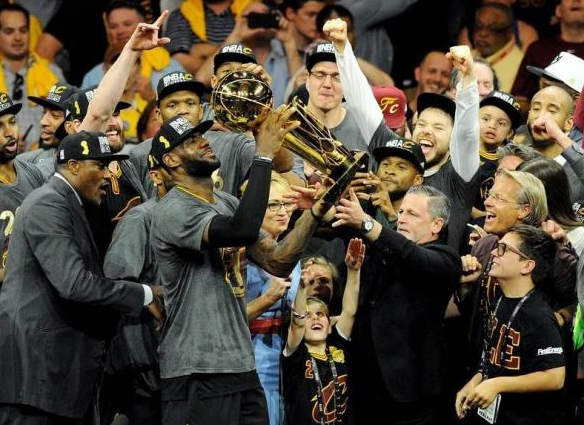 Jun 19, 2016; Oakland, CA, USA; Cleveland Cavaliers forward LeBron James (23) celebratew with the Larry O'Brien Championship Trophy after beating the Golden State Warriors in game seven of the NBA Finals at Oracle Arena. Mandatory Credit: Gary A. Vasquez-USA TODAY Sports
