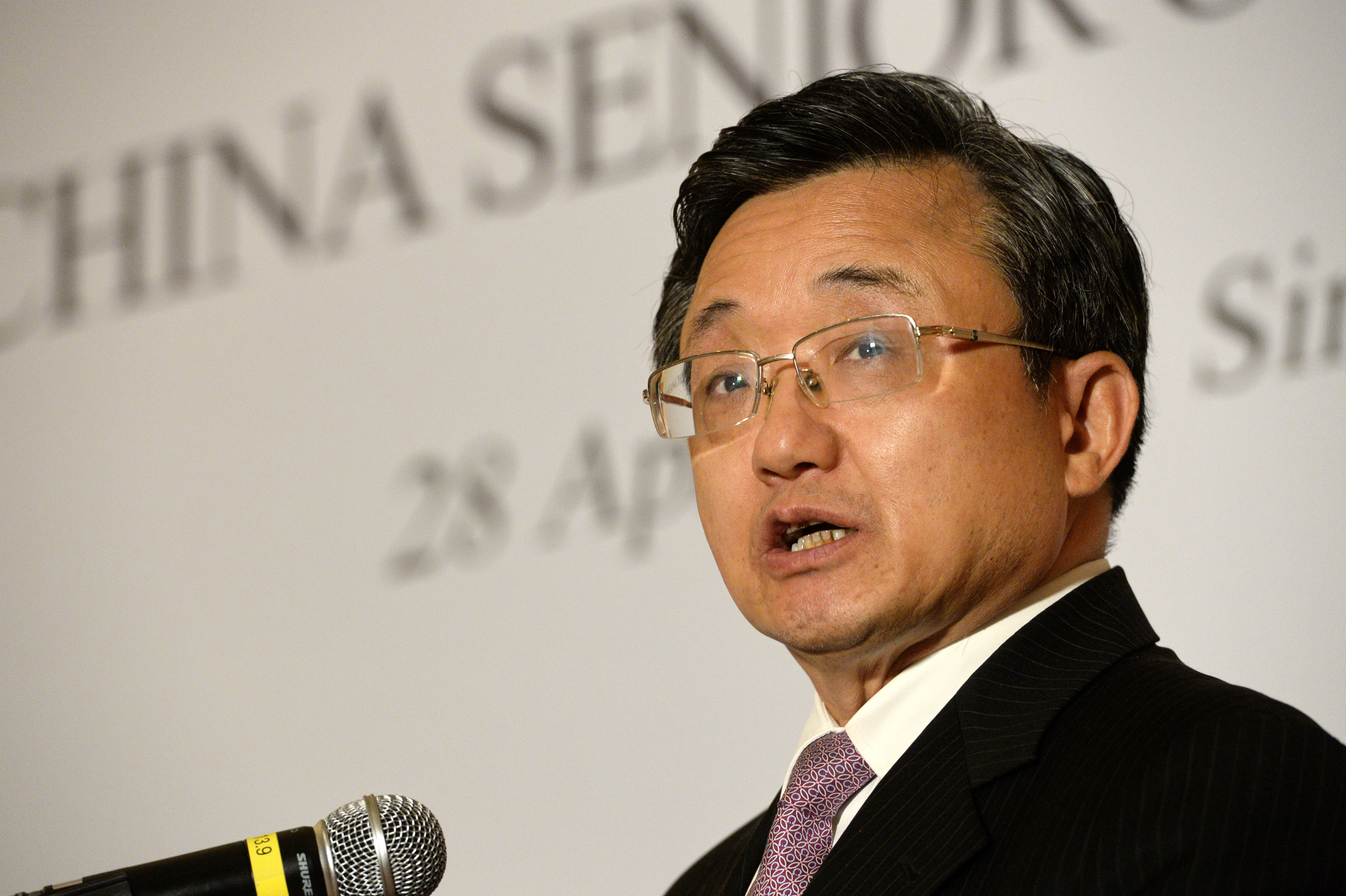 China's Foreign Affairs Vice Minister Liu Zhenmin briefs the media after the 22nd ASEAN-China Senior Officials Consultations meeting in Singapore on April 28, 2016. China and ASEAN senior officials met in Singapore to discuss the implementation of a declaration on conduct in the South China Sea. / AFP PHOTO / ROSLAN RAHMAN