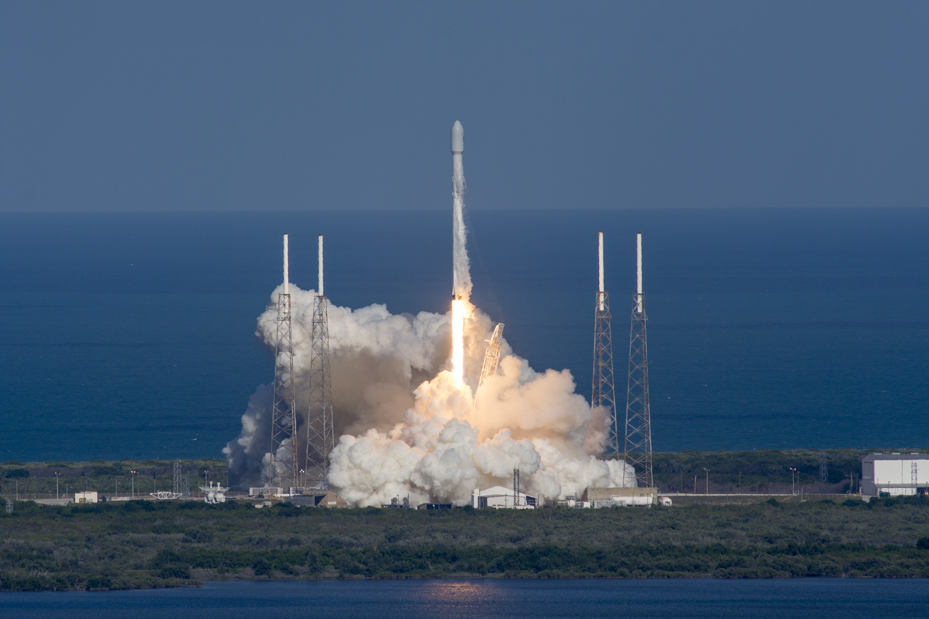 In this photo released by Space X's, the Thaicom 8 rocket lifts off from space launch complex 40 at Cape Canaveral, Florida on May 27, 2016  SpaceX launched an Asian communications satellite into a distant orbit and for the fourth time managed to recover the rocket that did the work.Under blue skies dotted with clouds, the shiny white Falcon 9 rocket blasted off from Cape Canaveral, Florida at 5:40 pm (2140 GMT) carrying the Thaicom 8 satellite.  / AFP PHOTO / SPACEX / spacex / RESTRICTED TO EDITORIAL USE - MANDATORY CREDIT "AFP PHOTO / SPACE X" - NO MARKETING - NO ADVERTISING CAMPAIGNS - DISTRIBUTED AS A SERVICE TO CLIENTS