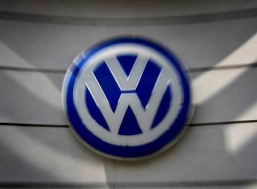 Volkswagen logos at a dealership in Los Angeles, California on June 28, 2016.  Volkswagen has agreed to pay out $14.7 billion in a settlement with US authorities and car owners over its emissions-cheating diesel-powered cars. The settlement filed in federal court calls for the German auto giant to either buy back or fix the cars that tricked pollution tests, and to pay each owner up to $10,000 in cash.  / AFP PHOTO / Mark Ralston