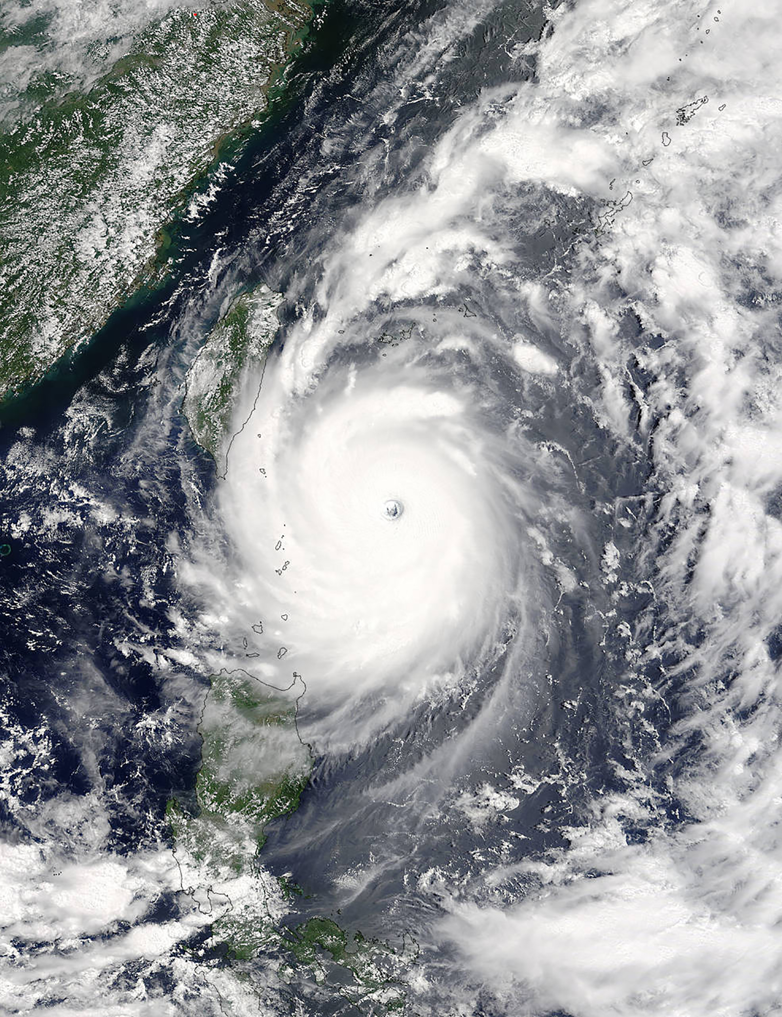 This image obtained from NASA on July 7, 2016, shows Super Typhoon Nepartak approaching Taiwan at 02:30 UTC on July 7 as captured by the MODIS instrument aboard NASA's Terra satellite. Taiwan cancelled more than 100 flights and shut schools and offices as the island braced for Nepartak, the first major tropical storm of the season. The typhoon was packing gusts of up to 245 kilometres an hour (152 miles an hour). It is expected to make landfall early July 8, according to Taiwan's Central Weather Bureau.  / AFP PHOTO / NASA / HO / RESTRICTED TO EDITORIAL USE - MANDATORY CREDIT "AFP PHOTO / NASA Goddard MODIS Rapid Response/Jeff Schmaltz" - NO MARKETING NO ADVERTISING CAMPAIGNS - DISTRIBUTED AS A SERVICE TO CLIENTS