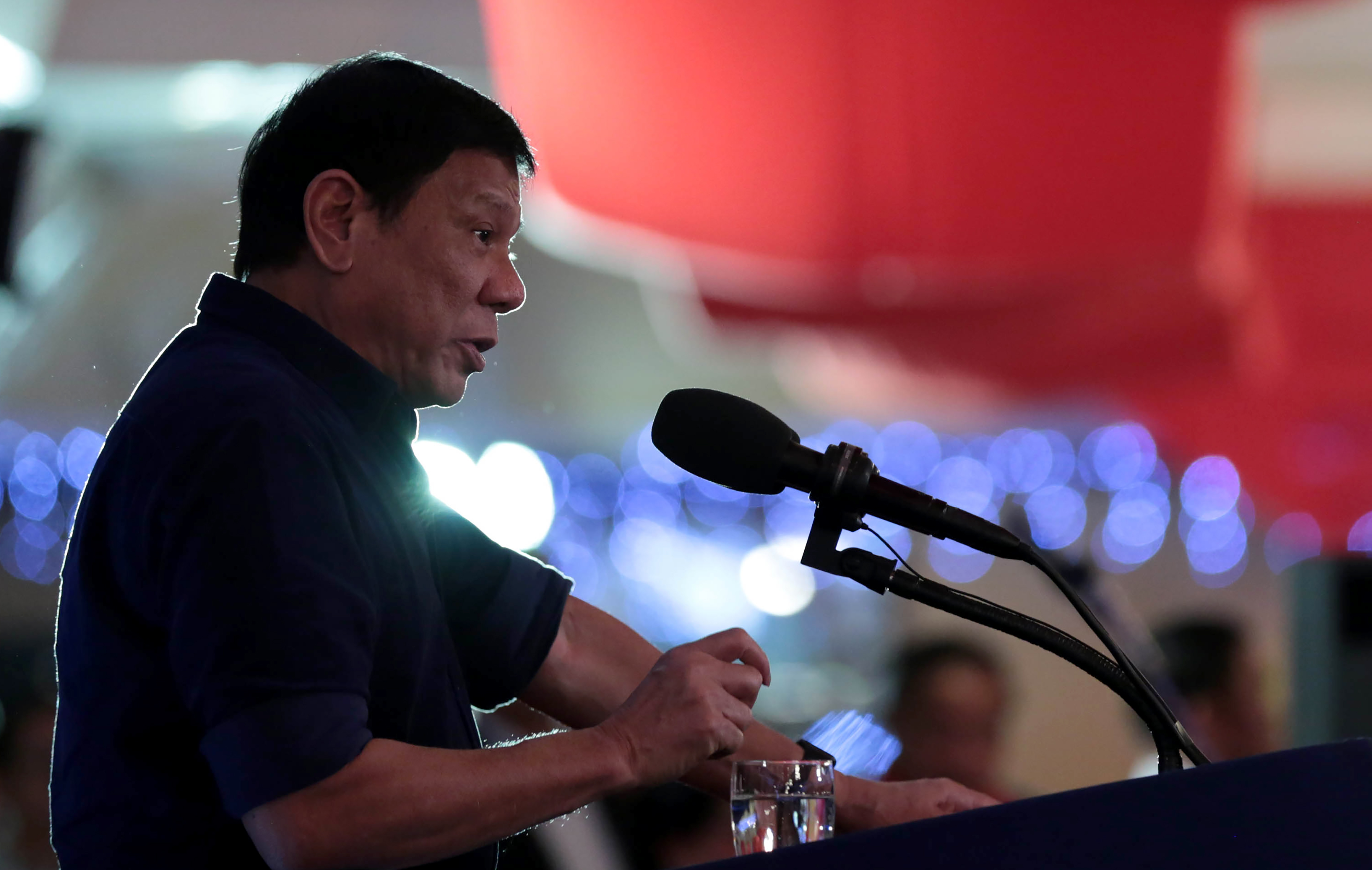 This handout received from the Presidential Communication Operations Office on July 15, 2016 shows Philippine President Rodrigo Duterte giving a speech during the Testimonial Dinner Reception in Manila on July 14, 2016. Philippine President Rodrigo Duterte announced late on July 14 he would send a former president, Fidel Ramos, to China to start talks on the ruling of The Hague-based Permanent Court of Arbitration. / AFP PHOTO / PRESIDENTIAL COMMUNICATION OPERATIONS OFFICE / STR / --- EDITORS NOTE --- RESTRICTED TO EDITORIAL USE - MANDATORY CREDIT "AFP PHOTO / PRESIDENTIAL COMMUNICATION OPERATIONS OFFICE " - NO MARKETING NO ADVERTISING CAMPAIGNS - DISTRIBUTED AS A SERVICE TO CLIENTS - NO ARCHIVES