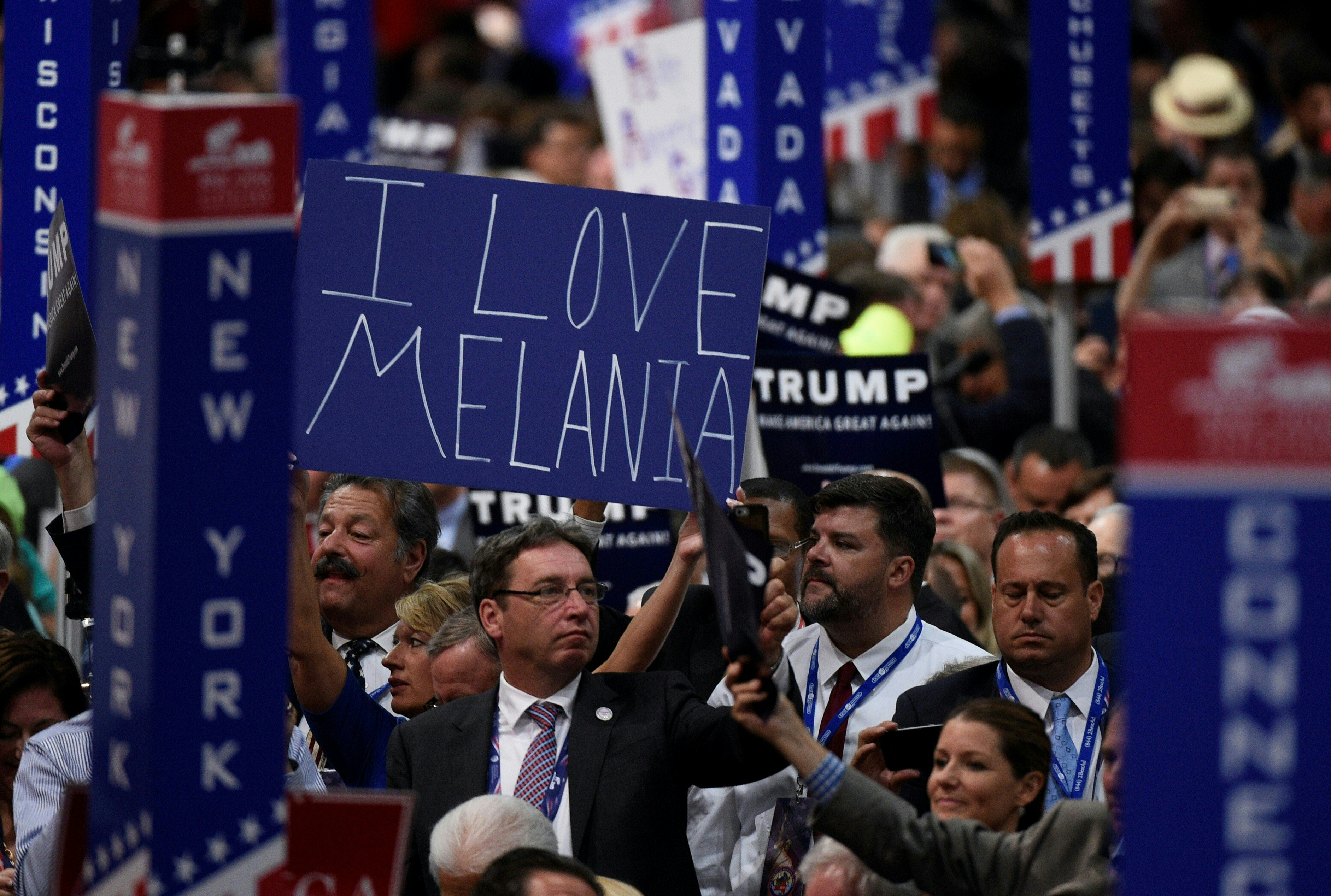 A delegate holds a sign during the second day of the Republican National Convention on July 19, 2016 at the Quicken Loans Arena in Cleveland, Ohio. The convention nominated Donald Trump for president. / AFP PHOTO / DOMINICK REUTER