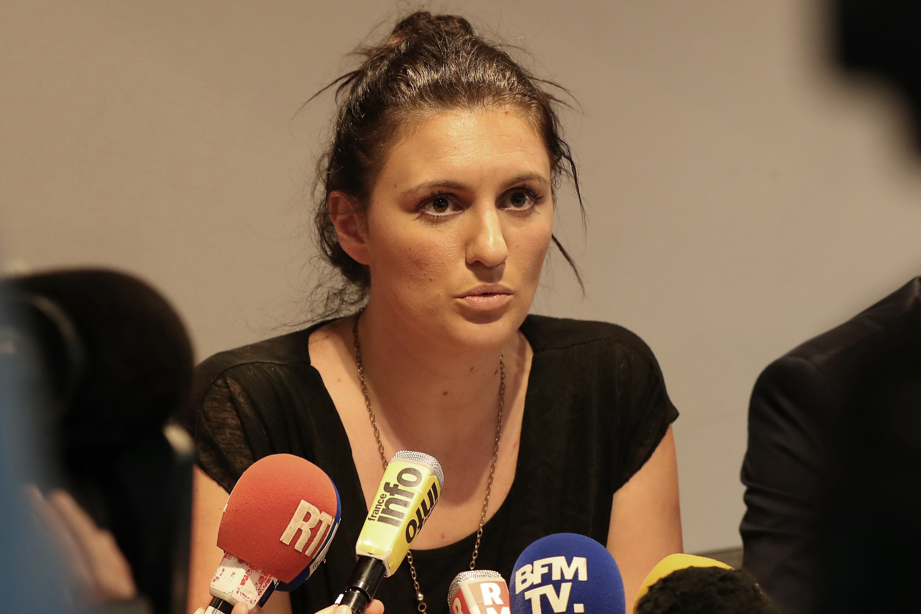French policewoman Sandra Bertin gives a press conference on July 24, 2015, in Nice, southeas tern France. A new crisis hit France's government on July 24, 2016, when a senior policewoman claimed the interior minister pressured her to alter a report into security at the Nice fireworks display where 84 were killed when a man rammed a lorry into the crowd. The minister, Bernard Cazeneuve -- whose account of police deployments on the night of July 14 celebrations has already faced questions -- has been the lightning rod for criticism over alleged security failures. Sandra Bertin, who is in charge of Nice's system of security cameras, told the Journal du Dimanche newspaper she had been "harassed for an hour" by Cazeneuve on the phone after he sent a commissioner to see her the day after the attack. / AFP PHOTO / VALERY HACHE