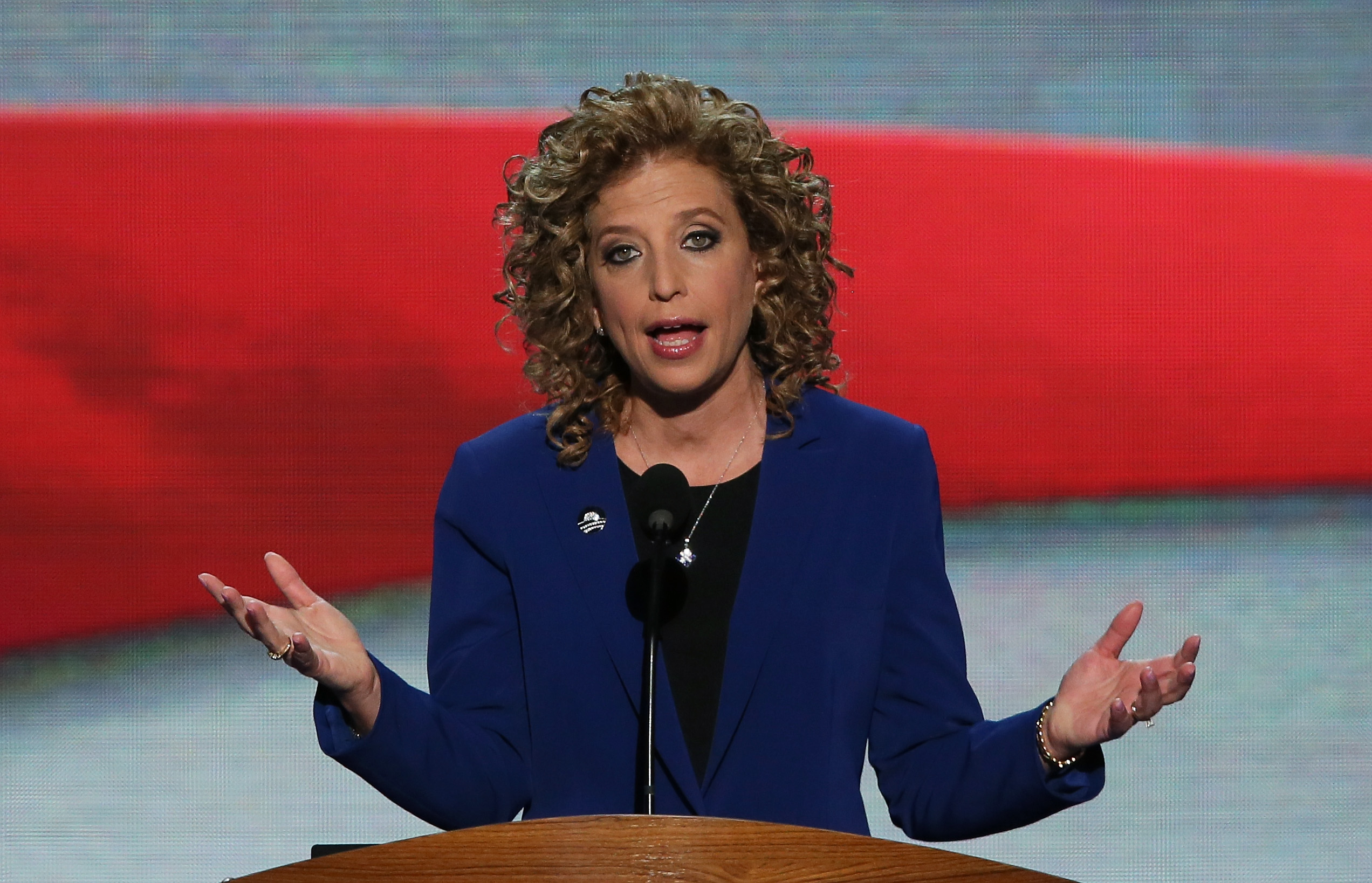 (FILES) This file photo taken on September 05, 2012 shows Democratic National Committee Chair Debbie Wasserman Schultz speaking on stage during the final day of the Democratic National Convention at Time Warner Cable Arena in Charlotte, North Carolina.  Embattled Democratic Party chair Debbie Wasserman Schultz said Sunday, July 24, 2016 she is resigning, following a leak of emails suggesting an insider attempt to hobble the campaign of Hillary Clinton's rival in the White House primaries Bernie Sanders.  / AFP PHOTO / GETTY IMAGES NORTH AMERICA / ALEX WONG