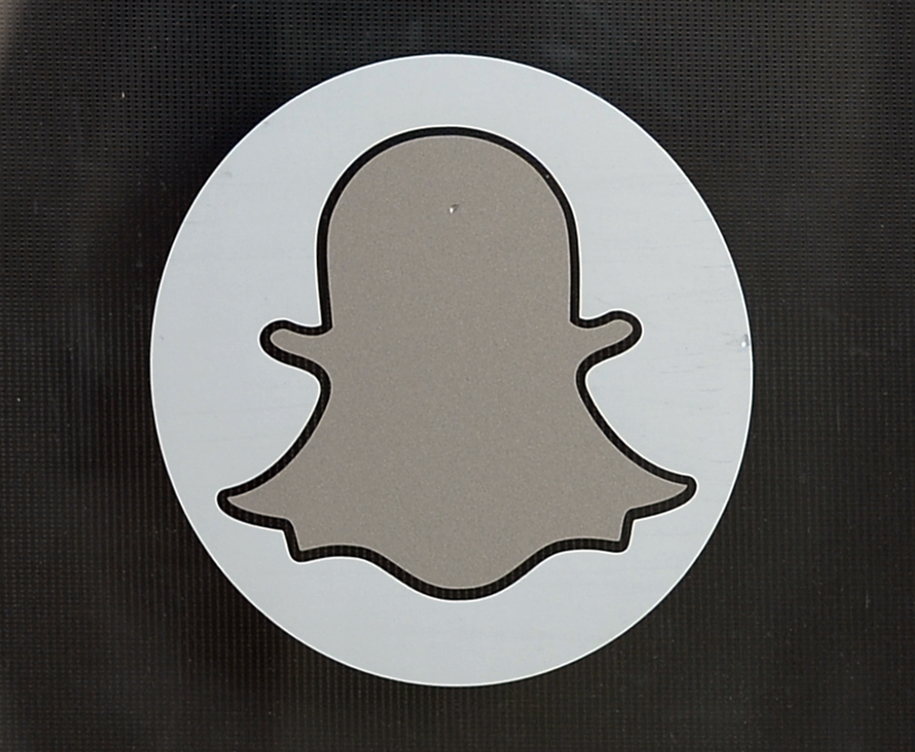 VENICE, CA-NOVEMBER-14: Logo of Snapchat is seen at the front entrance new headquarters of Snapchat , the popular social network startup that lets users send each other photos that quickly disappear, November 14, 2013 in Venice, California. Snapchat recently turned down a $3-billion buyout offer from Facebook.   Kevork Djansezian/Getty Images/AFP