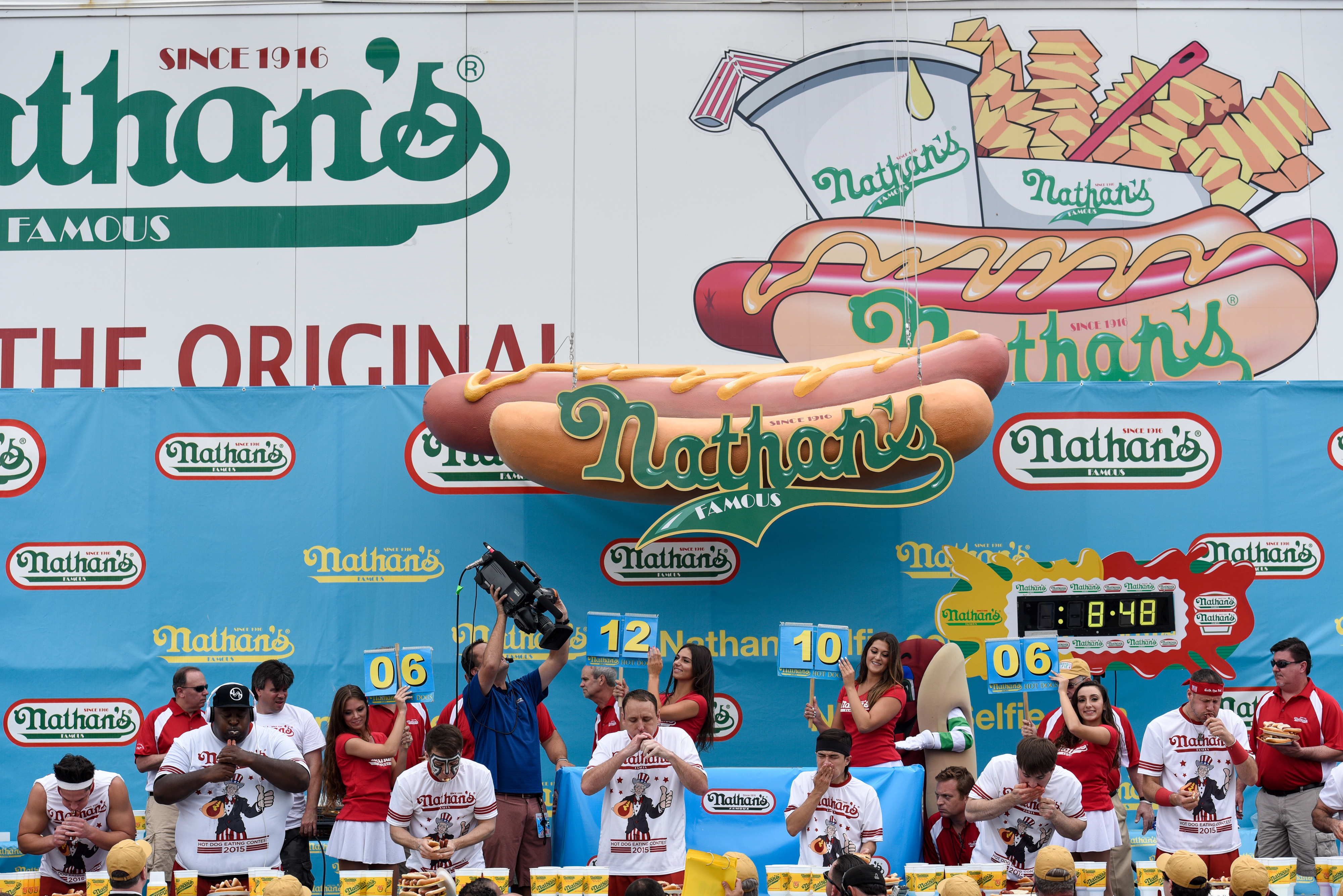 NEW YORK, NY - JULY 4: The mens round at The Nathan's Famous Fourth of July International Hot Dog-Eating Contest in Coney Island, New York, on July 4, 2015. The contest is an annual Fourth of July tradition.   Andrew Renneisen/Getty Images/AFP