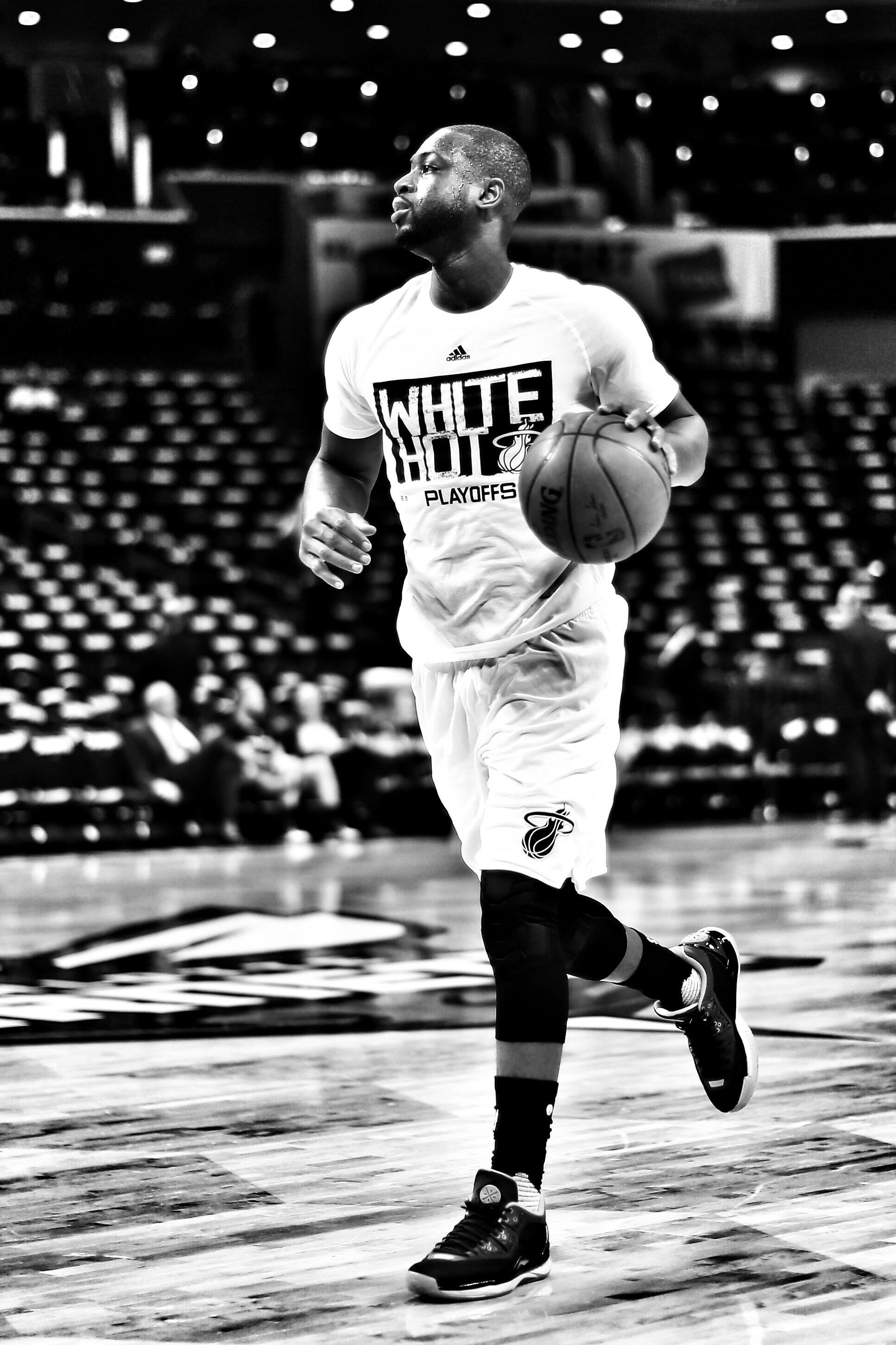 CHARLOTTE, NC - APRIL 23: (EDITORS NOTE: THIS IMAGE HAS BEEN CREATED WITH THE USE OF DIGITAL FILTERS) Dwyane Wade #3 of the Miami Heat warms up before their game against the Charlotte Hornets in game three of the Eastern Conference Quarterfinals of the 2016 NBA Playoffs at Time Warner Cable Arena on April 23, 2016 in Charlotte, North Carolina. NOTE TO USER: User expressly acknowledges and agrees that, by downloading and or using this photograph, User is consenting to the terms and conditions of the Getty Images License Agreement. Streeter Lecka/Getty Images/AFP