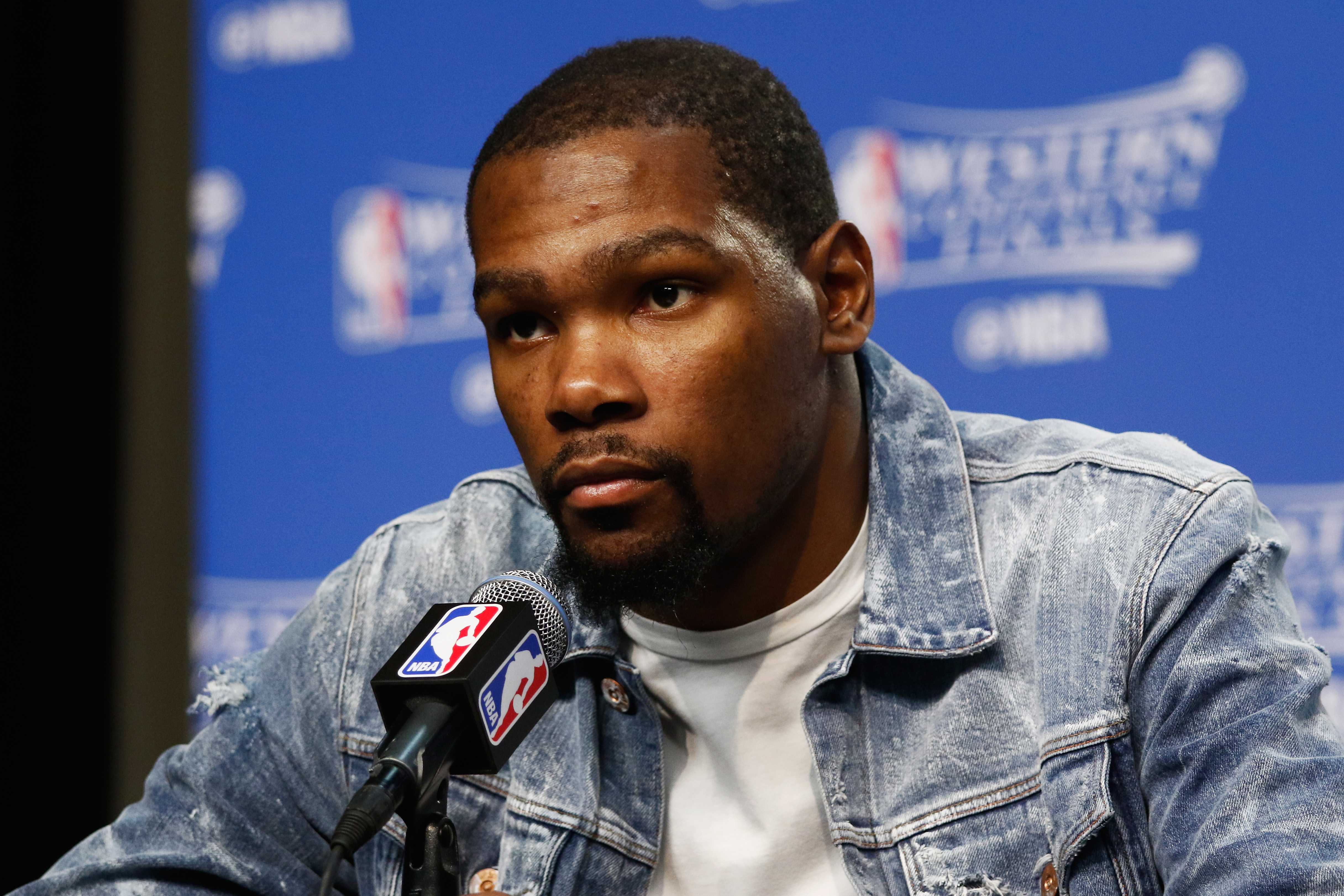 OKLAHOMA CITY, OK - MAY 28: Kevin Durant #35 of the Oklahoma City Thunder looks on during a press conference after the Golden State Warriors defeated the Oklahoma City Thunder 108-101 in game six of the Western Conference Finals during the 2016 NBA Playoffs at Chesapeake Energy Arena on May 28, 2016 in Oklahoma City, Oklahoma. NOTE TO USER: User expressly acknowledges and agrees that, by downloading and or using this photograph, User is consenting to the terms and conditions of the Getty Images License Agreement.   J Pat Carter/Getty Images/AFP