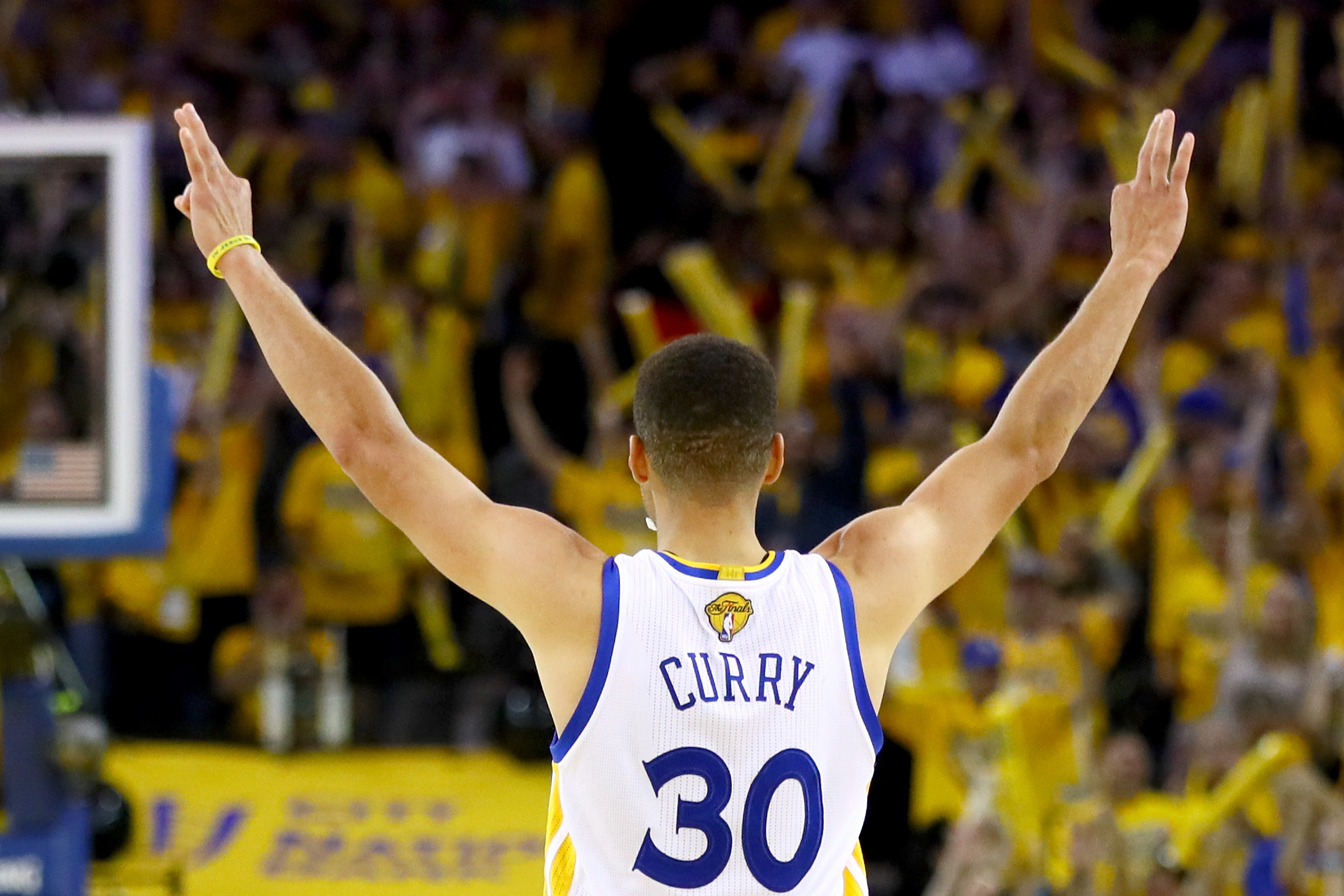 OAKLAND, CA - JUNE 19: Stephen Curry #30 of the Golden State Warriors reacts after scoring a three-point basket against the Cleveland Cavaliers in Game 7 of the 2016 NBA Finals at ORACLE Arena on June 19, 2016 in Oakland, California. NOTE TO USER: User expressly acknowledges and agrees that, by downloading and or using this photograph, User is consenting to the terms and conditions of the Getty Images License Agreement.   Ezra Shaw/Getty Images/AFP
