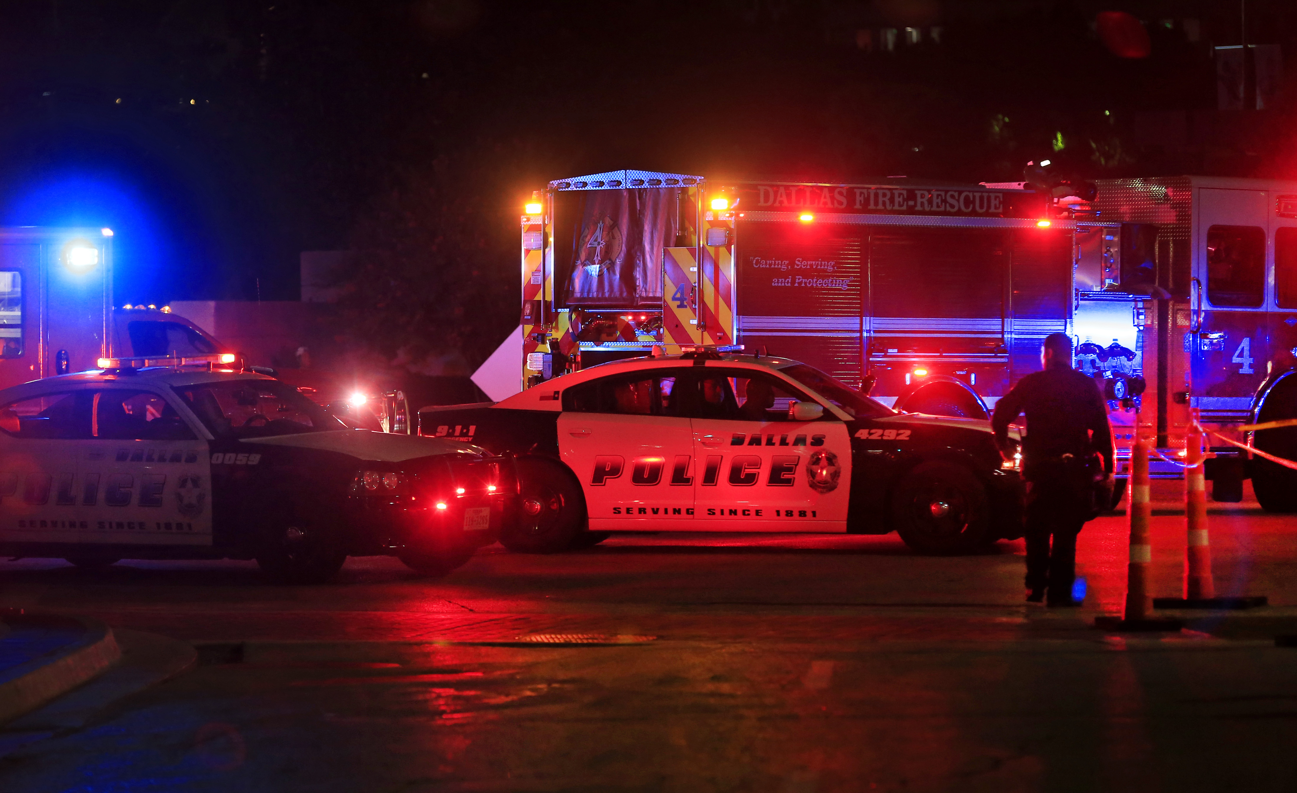 DALLAS, TX - JULY 8: Dallas police work near the scene where eleven Dallas police officers were shot and five have now died on July 7, 2016 in Dallas, Texas. According to reports, shots were fired during a protest being held in downtown Dallas in response to recent fatal shootings of two black men by police - Alton Sterling on July 5, 2016 in Baton Rouge, Louisiana and Philando Castile on July 6, 2016, in Falcon Heights, Minnesota.   Ron Jenkins/Getty Images/AFP