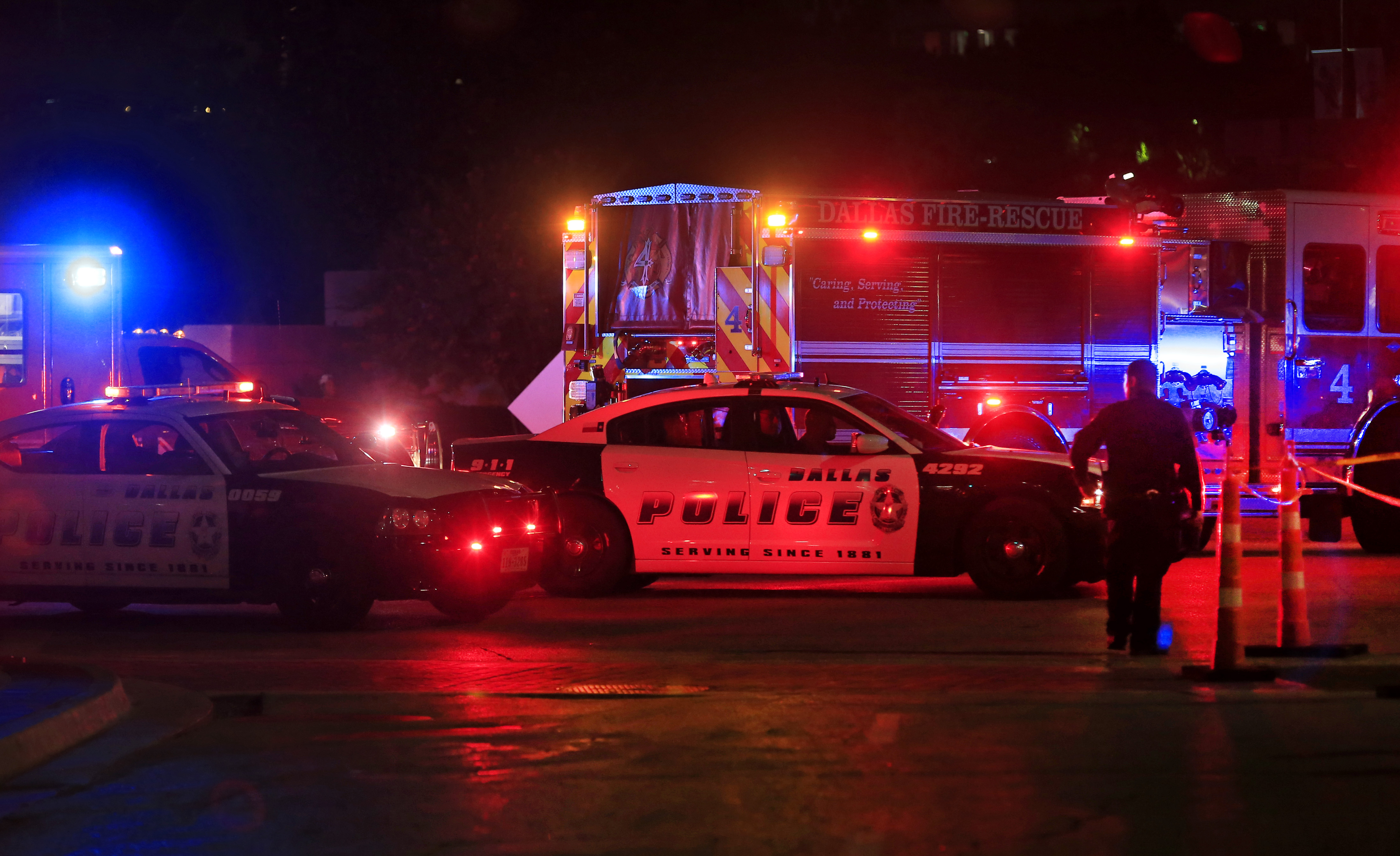 DALLAS, TX - JULY 8: Dallas police work near the scene where eleven Dallas police officers were shot and five have now died on July 7, 2016 in Dallas, Texas. According to reports, shots were fired during a protest being held in downtown Dallas in response to recent fatal shootings of two black men by police - Alton Sterling on July 5, 2016 in Baton Rouge, Louisiana and Philando Castile on July 6, 2016, in Falcon Heights, Minnesota. Ron Jenkins/Getty Images/AFP
