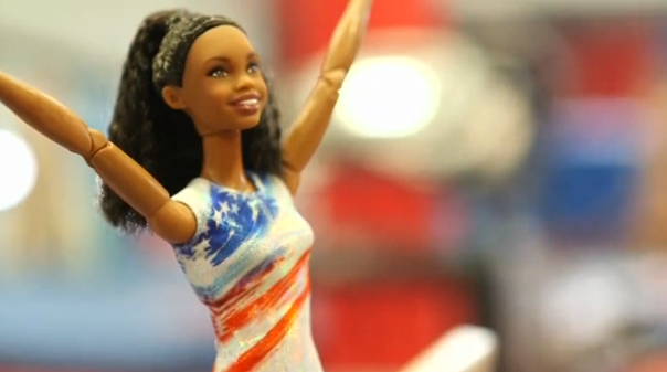 Olympic gymnast Gabby Douglas gets a Barbie doll created in her likeness. (Photo captured from Reuters video)